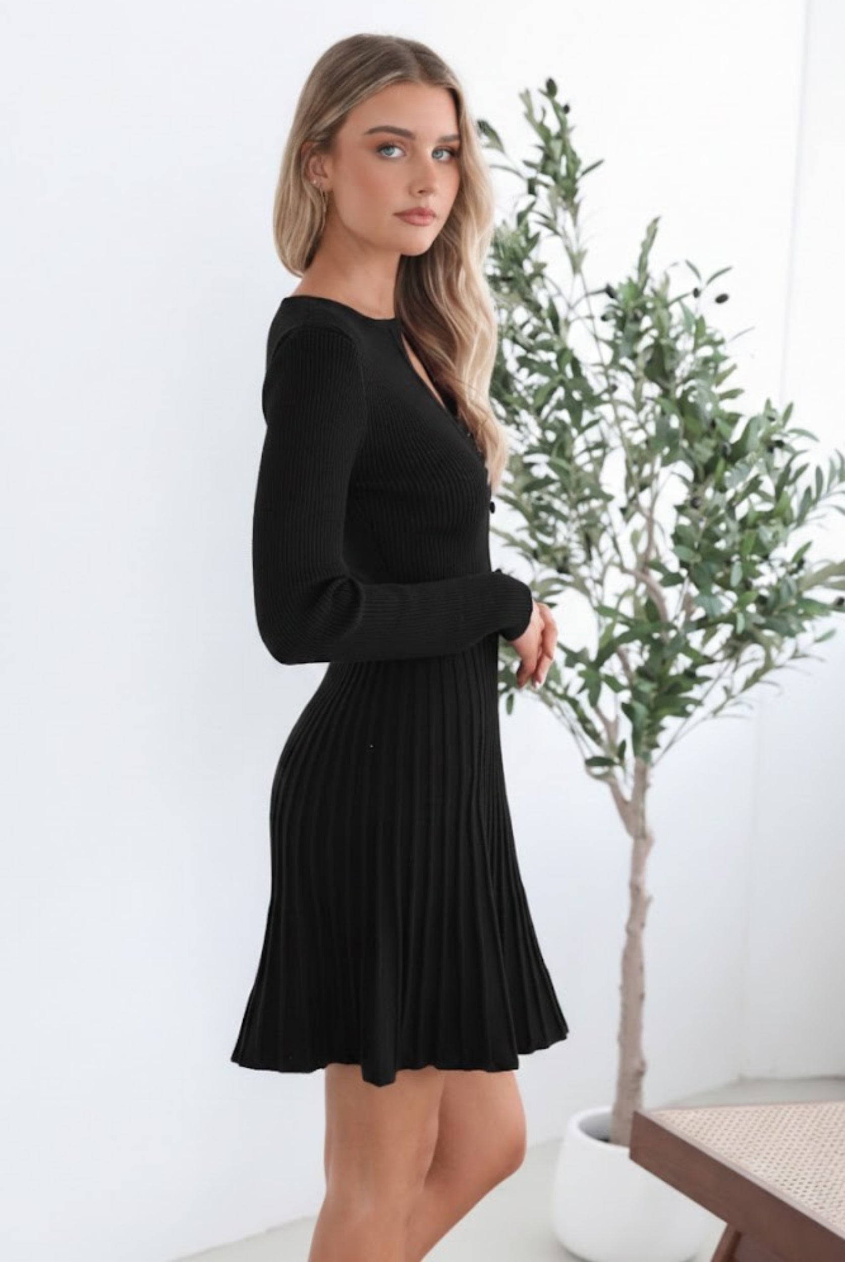 Marifi Knit Dress in Black womens black knit midi dress back view showing pleated skirt