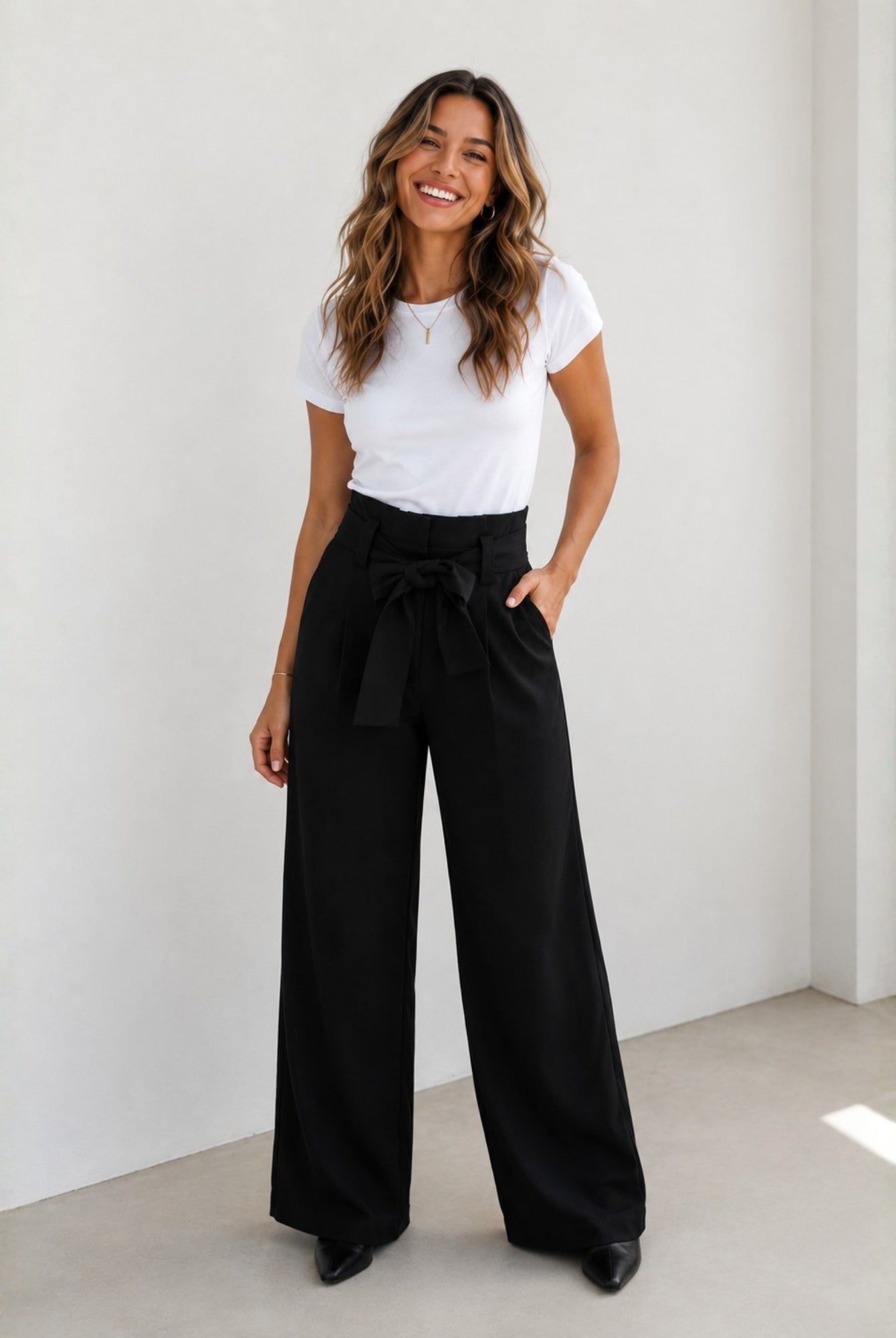 Women's black wide leg trousers with a paperbag waist, the Alma Pants in Black by Esther & Co