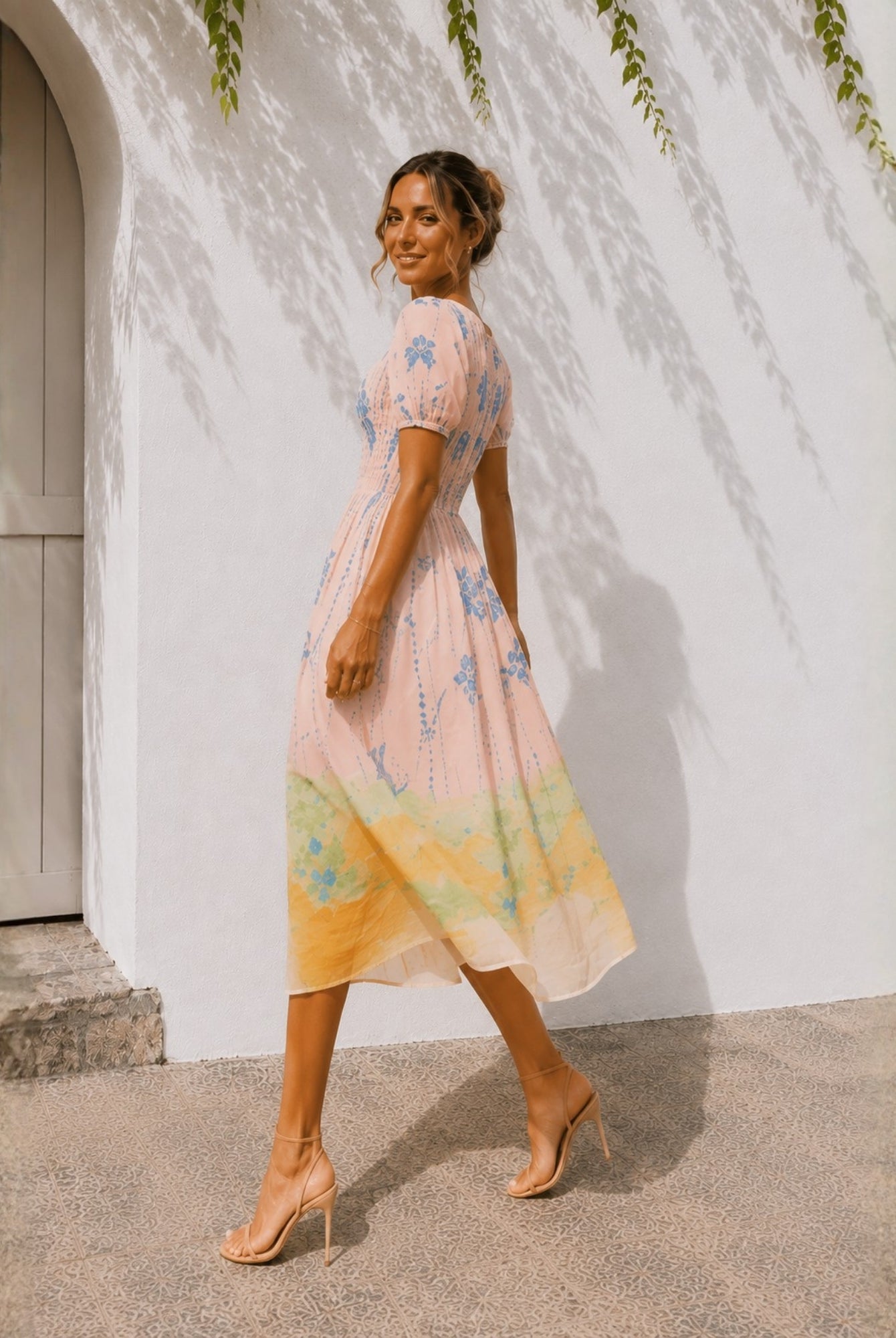 Women's pastel pink pleated bodice midi dress with puff sleeves, the Aseana Dress in Island Dream by Esther & Co