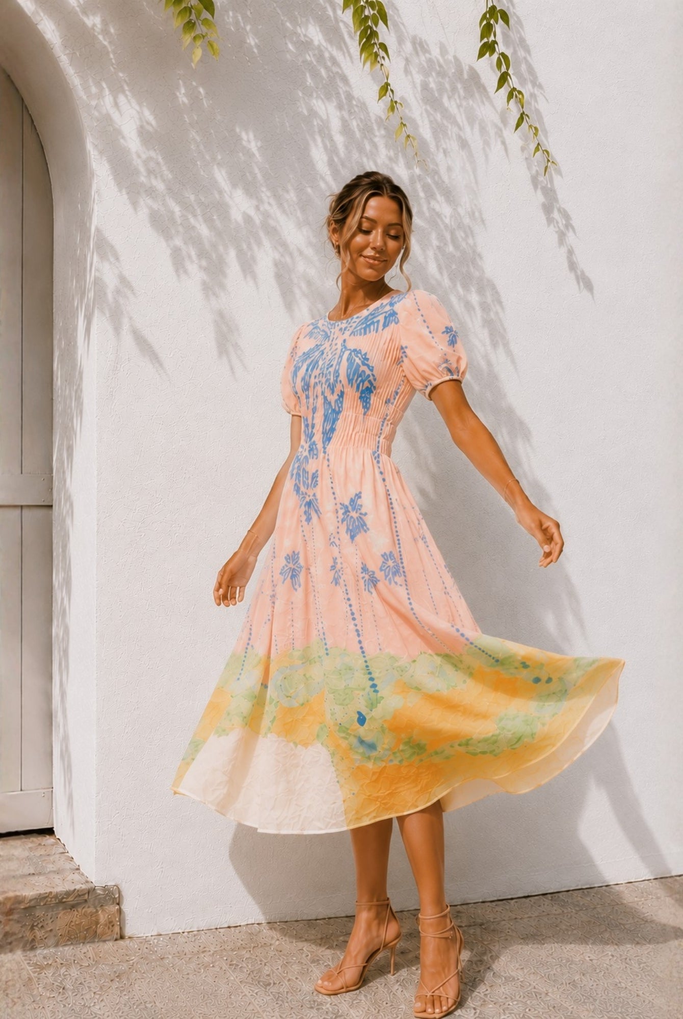 Women's pastel pink embroidered midi dress with puff sleeves, the Aseana Dress in Island Dream by Esther & Co
