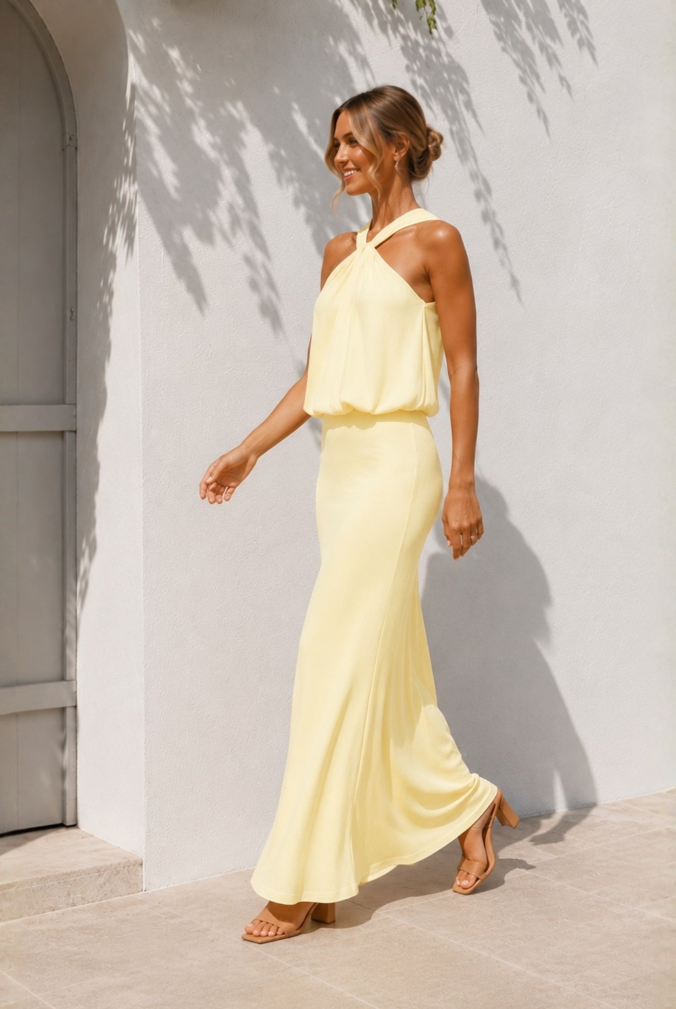 Women's yellow halter maxi dress side view by Esther & Co