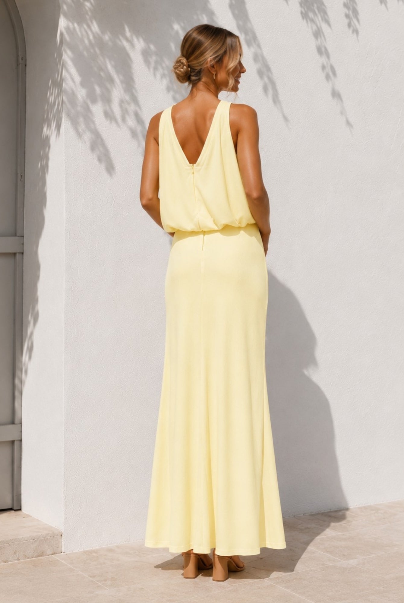 Women's yellow halter maxi dress styled outfit by Esther & Co