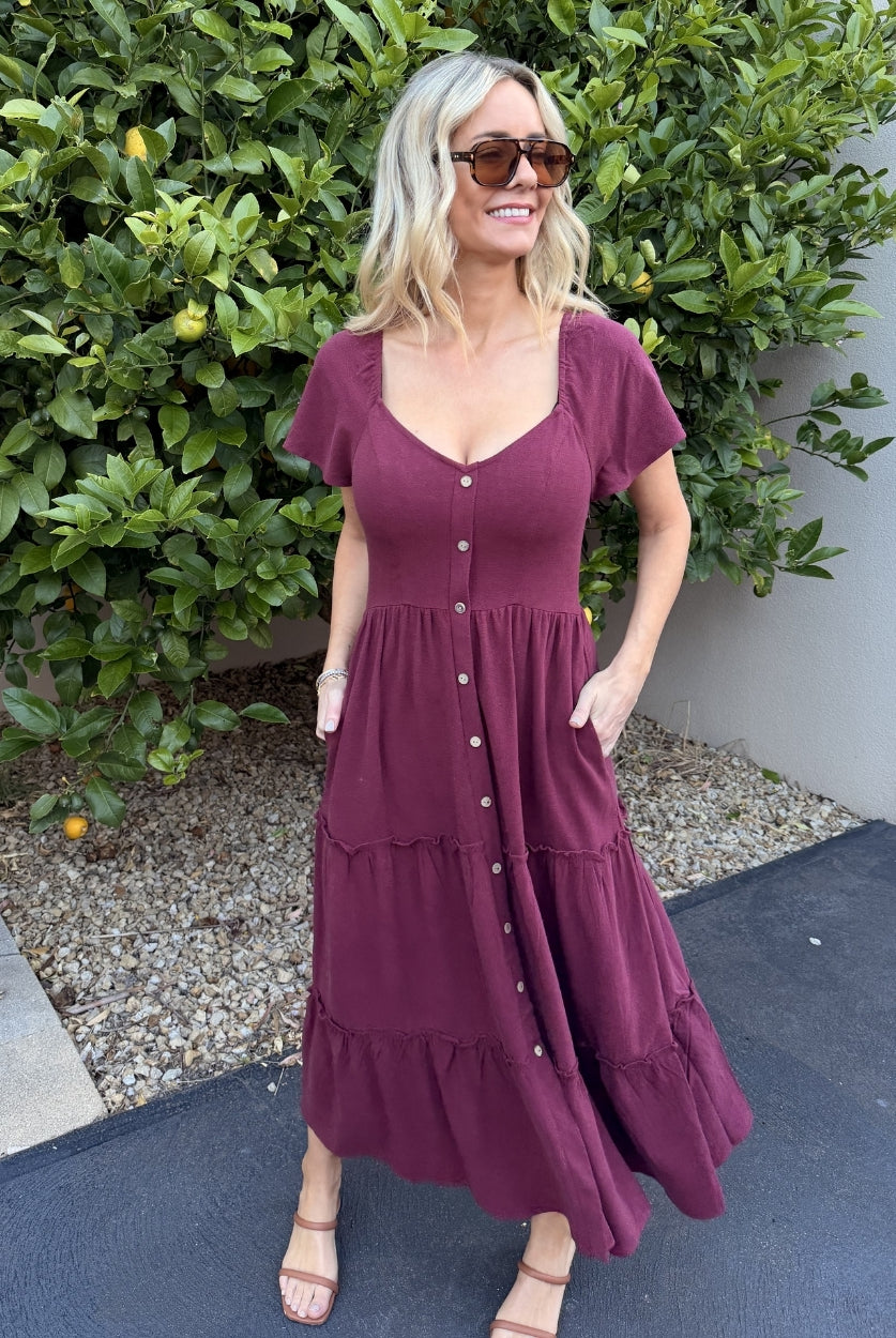Front view of the Celie Bordeaux Linen Midi Dress showing the V-neckline and flowing A-line silhouette