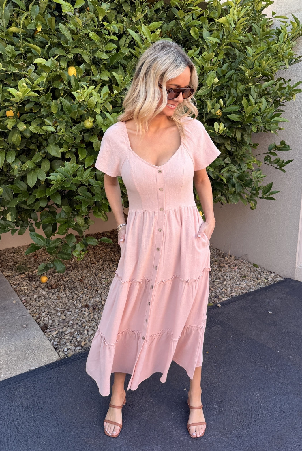 Celie pink tiered linen midi dress, styled view