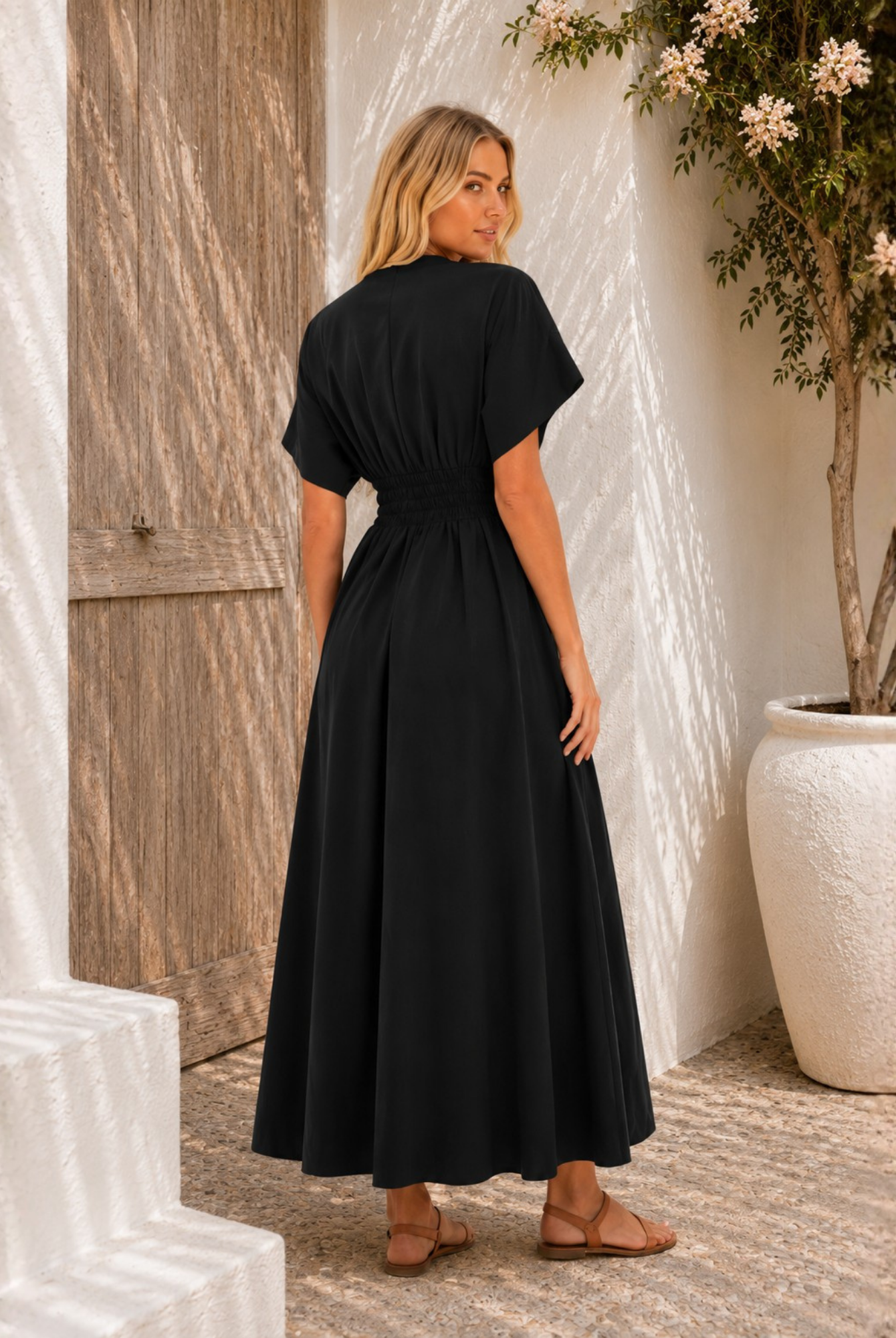 Women's black v-neck maxi dress with statement front buttons, the Clairice Dress in Black by Esther & Co