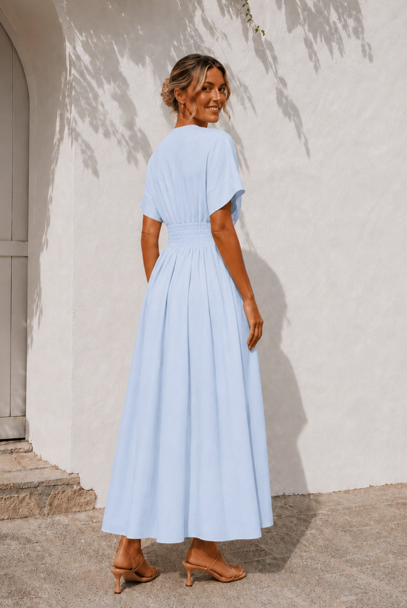 Women's blue pleated maxi dress with structured waist panel, the Clairice Dress in Blue by Esther & Co