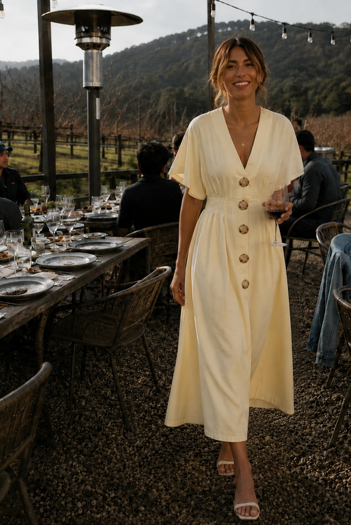 Women's buttercream yellow pleated maxi dress with statement front buttons, the Clairice Dress in Buttercream by Esther & Co