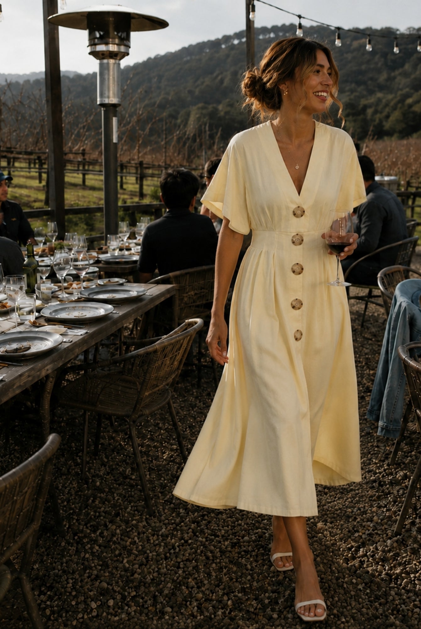 Women's buttercream yellow pleated maxi dress with statement front buttons, the Clairice Dress in Buttercream by Esther & Co