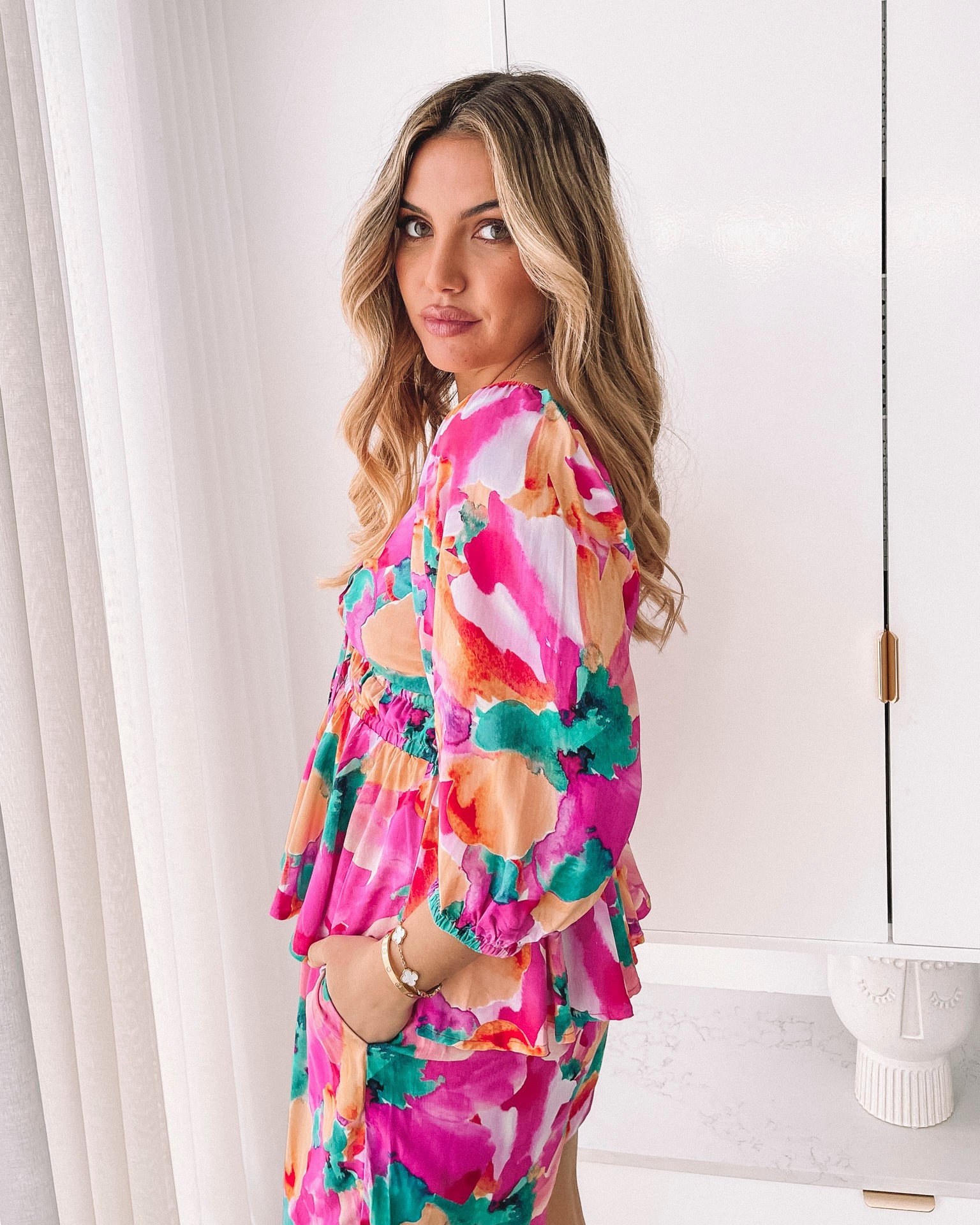 Women's pink fiesta print peplum top with sweetheart neckline, the Conley Top in Pink Fiesta by Esther & Co
