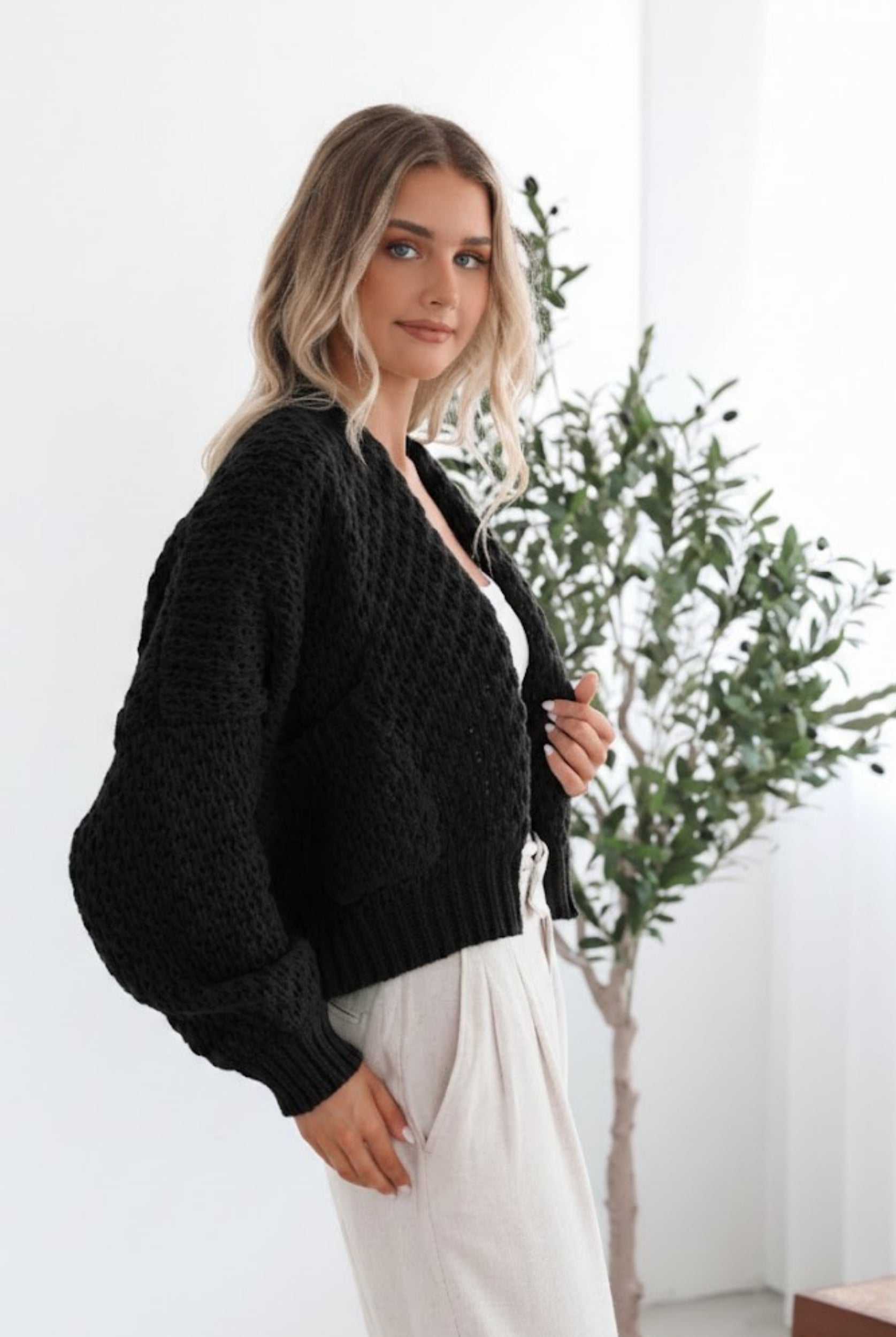 Dorine Cardigan in Black womens black chunky knit cardigan back view