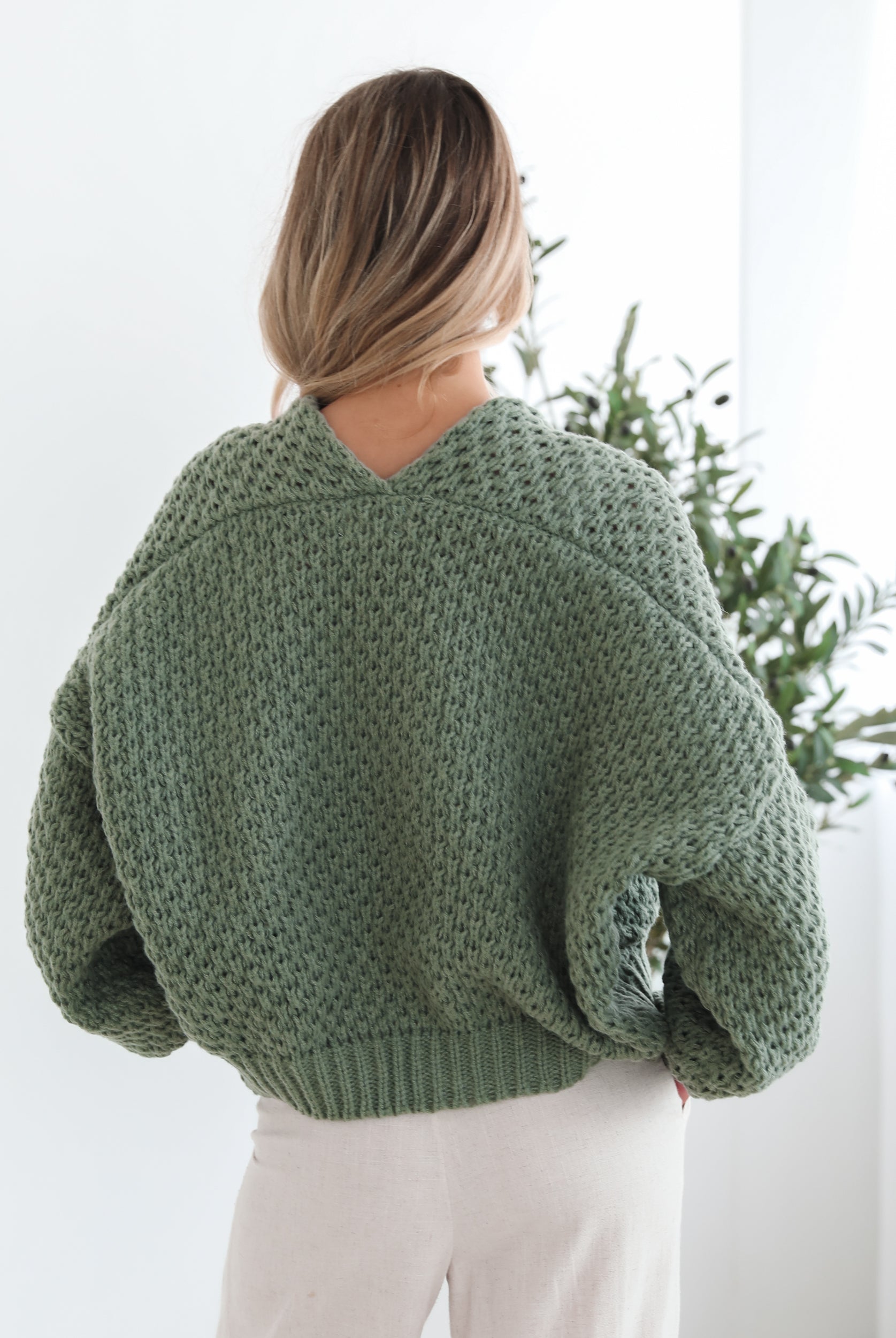 Front view of the Dorine Cardigan in Forest Green showing the textured knit and relaxed fit
