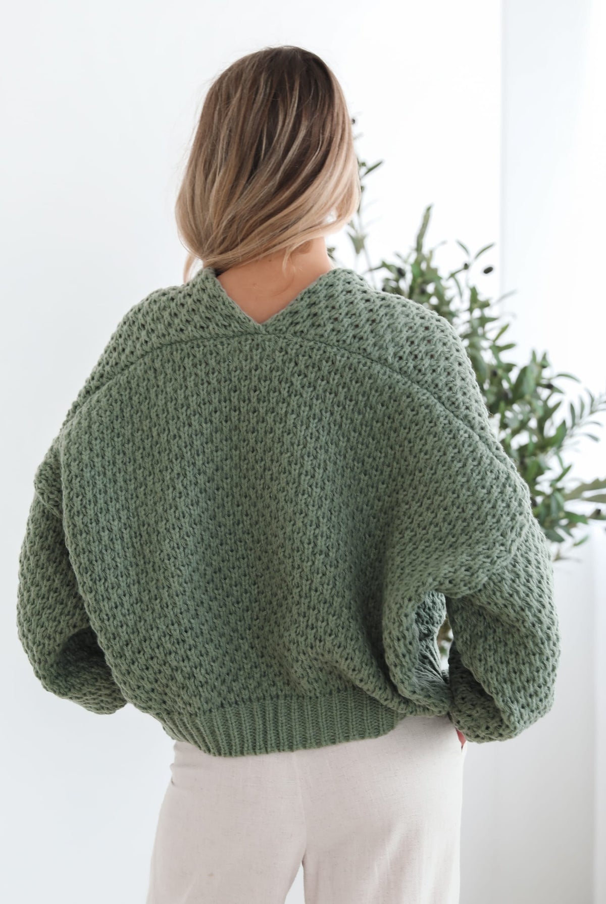 Front view of the Dorine Cardigan in Forest Green showing the textured knit and relaxed fit