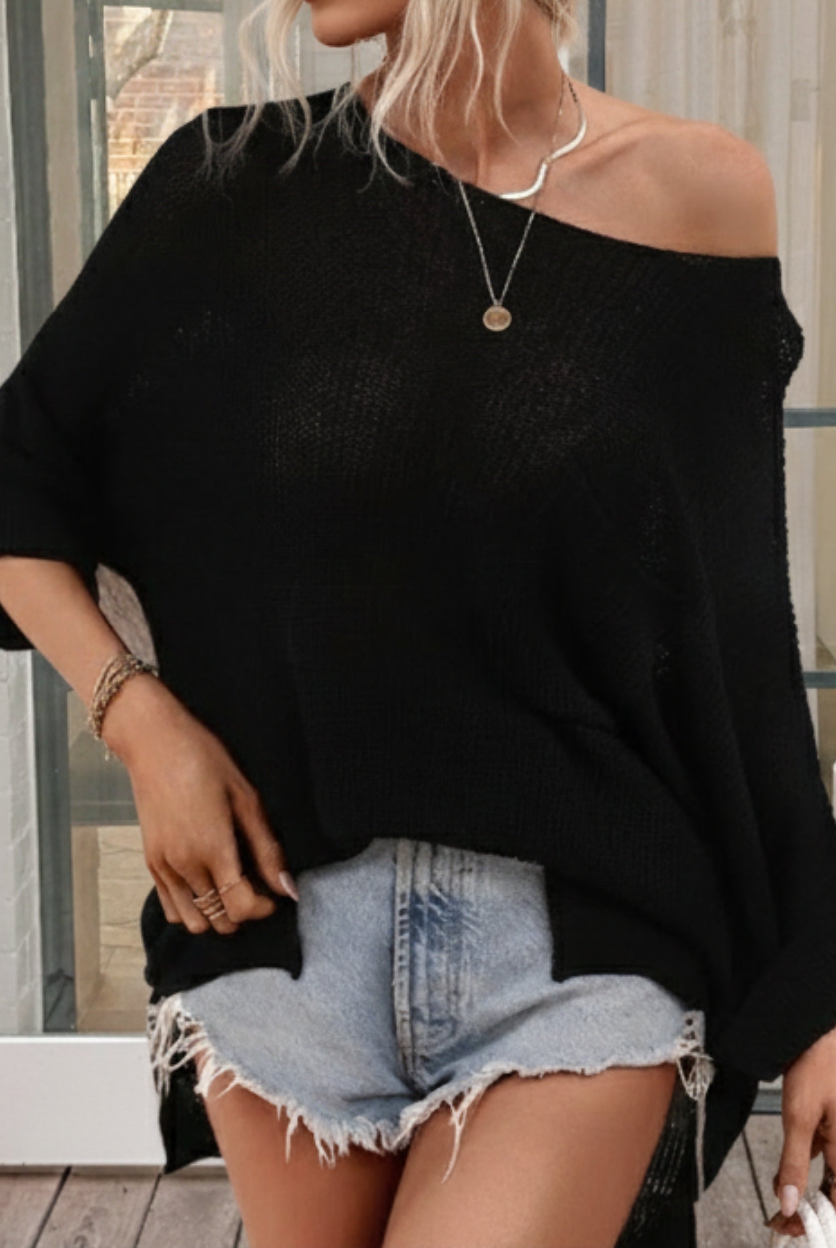 Evandra black knit top, side view