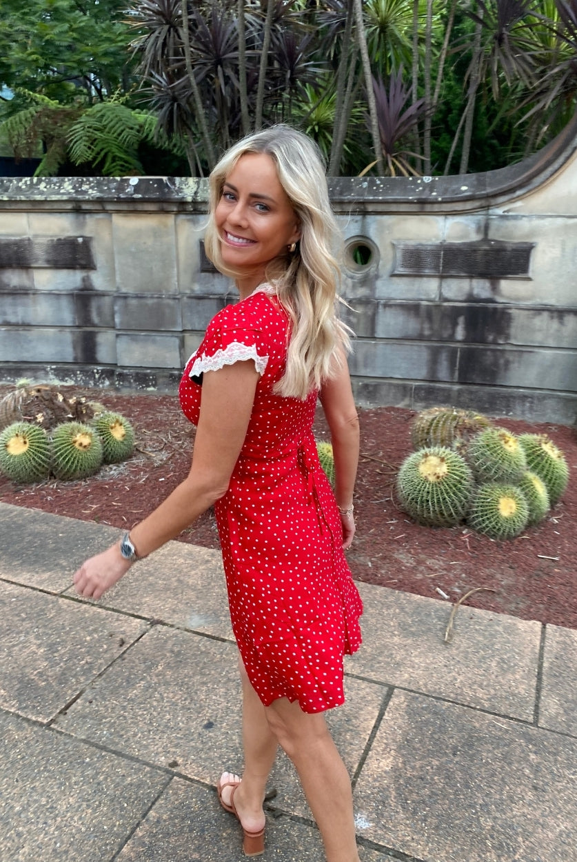 Women's red and white polka dot mini dress front view by Esther & Co