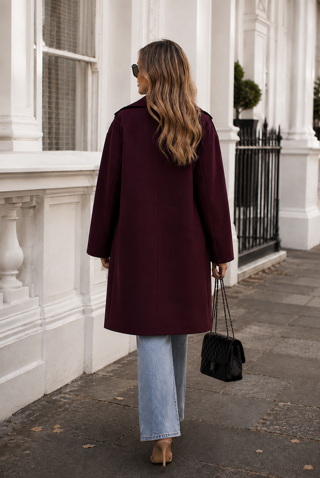Women's plum knit trench coat shown from the back, the Fireplace Coat in Plum by Esther & Co