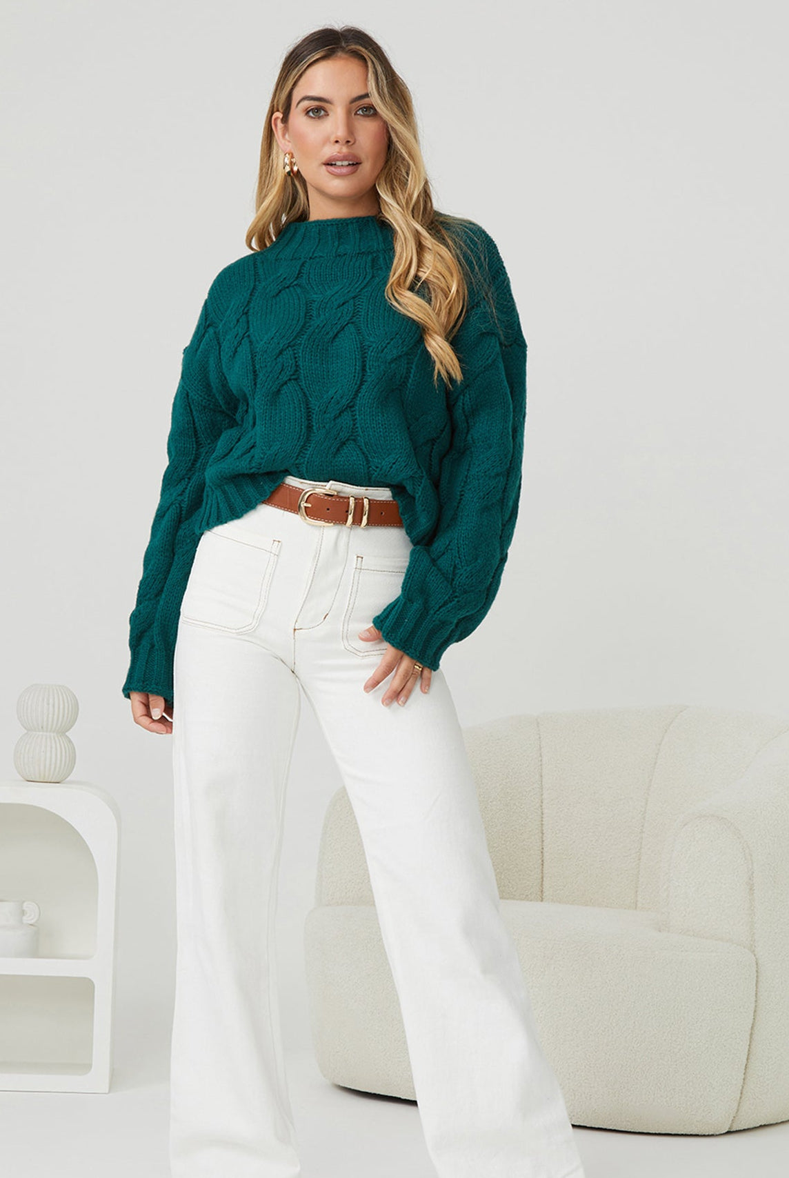 Front view of the Hadi Dark Green Knit showing the high round neckline and relaxed textured knit