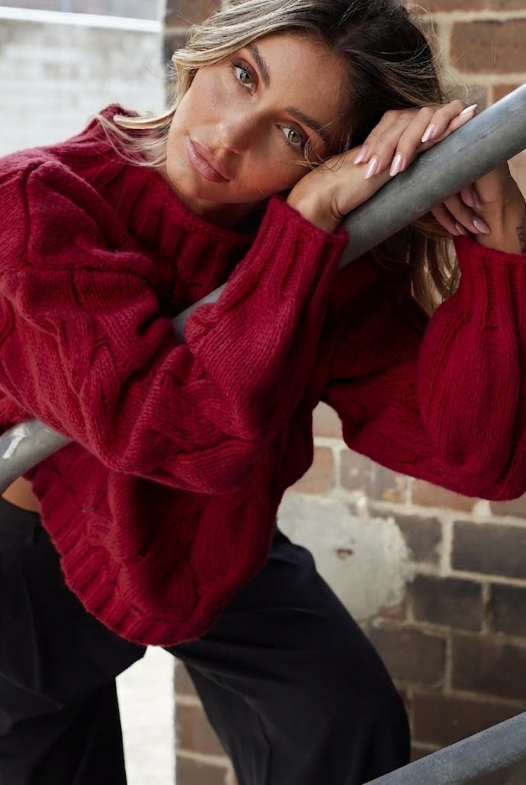 Front view of the Hadi Wine Knit showing the high round neckline and relaxed textured knit