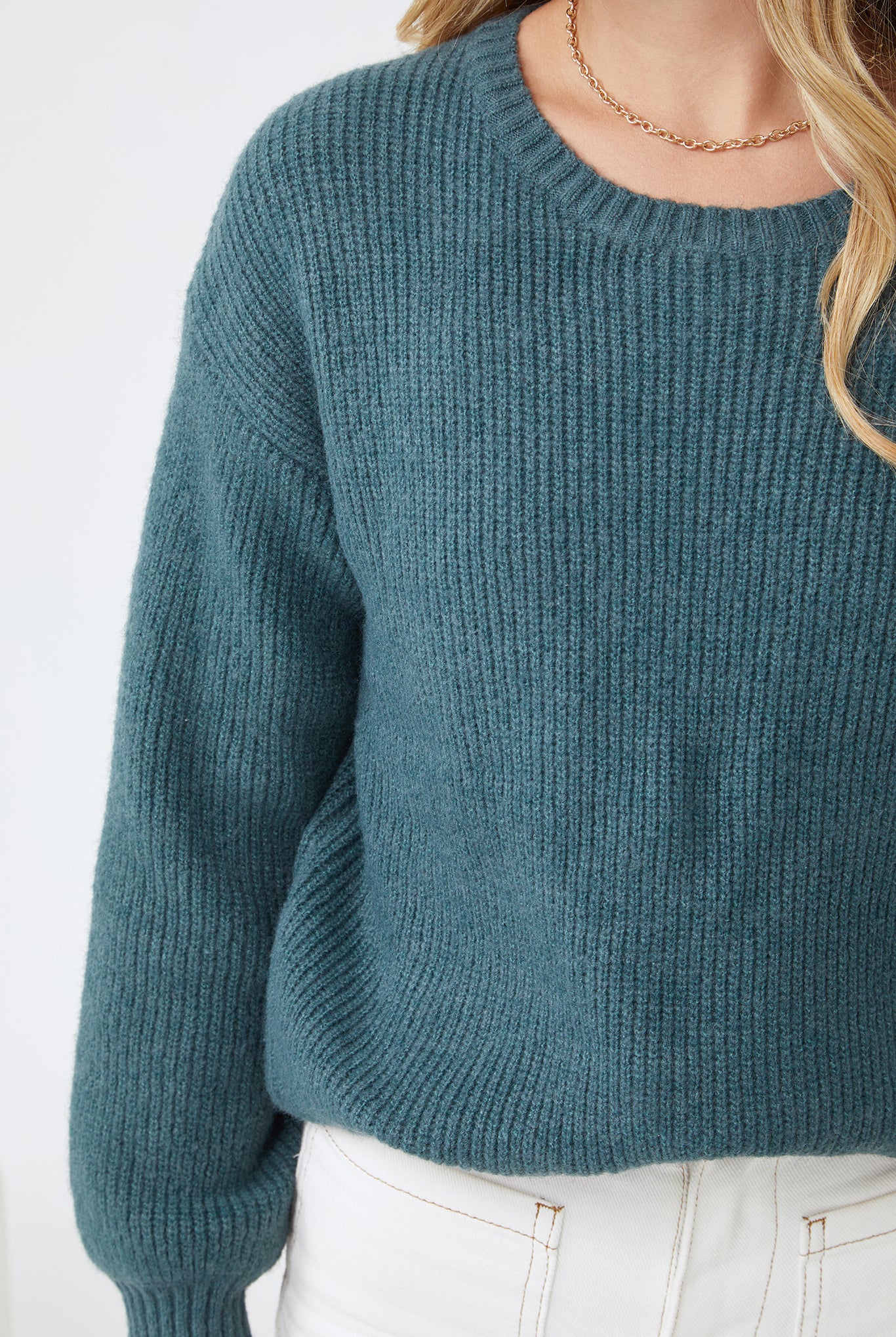 Full length view of the Harvie Knit in Petrol by Esther and Co showing the rich teal colour and relaxed silhouette