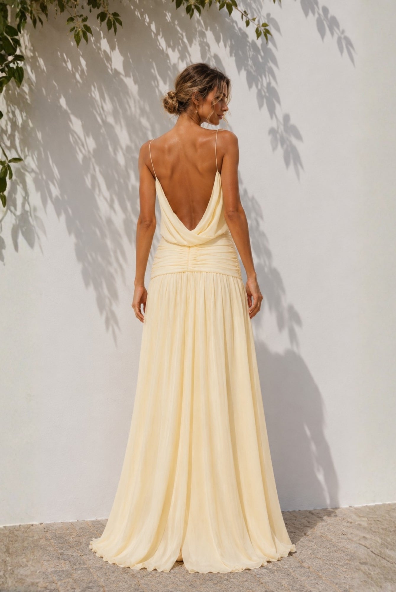 Women's pastel yellow backless maxi dress, the Hermione Dress in Sunlit Veil by Esther & Co