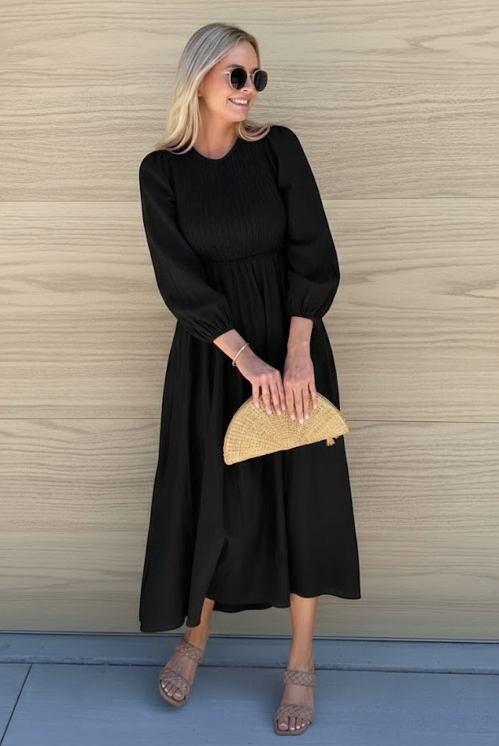 Front view of the Iolana Black Long Sleeve Midi Dress showing the round neckline and textured A-line fit