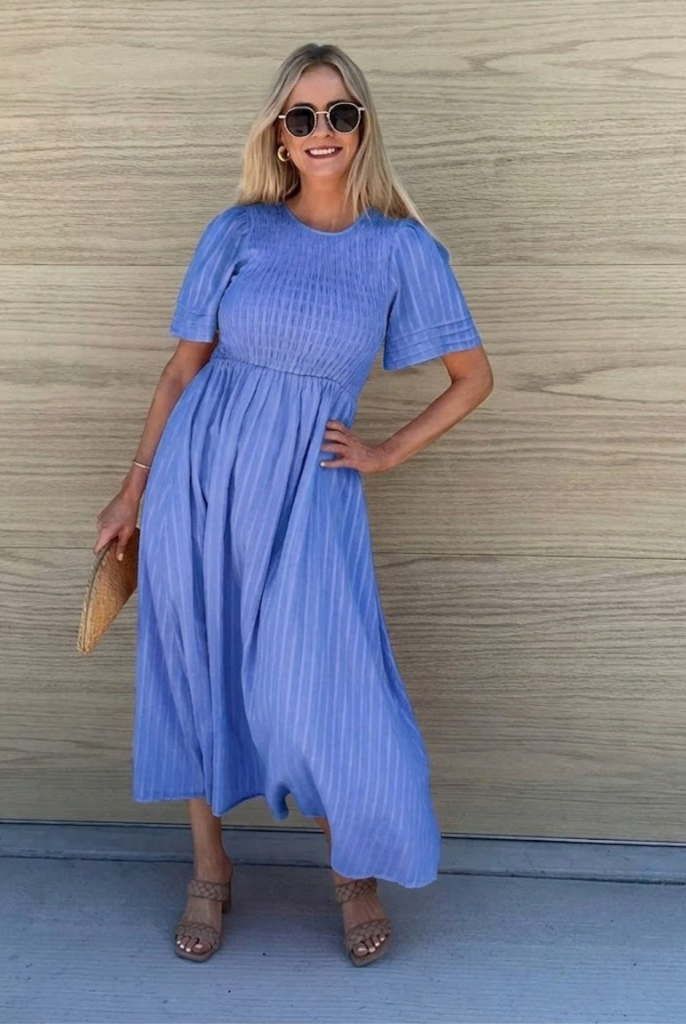 Women's flowy blue cotton dress styled for a garden wedding by Esther & Co