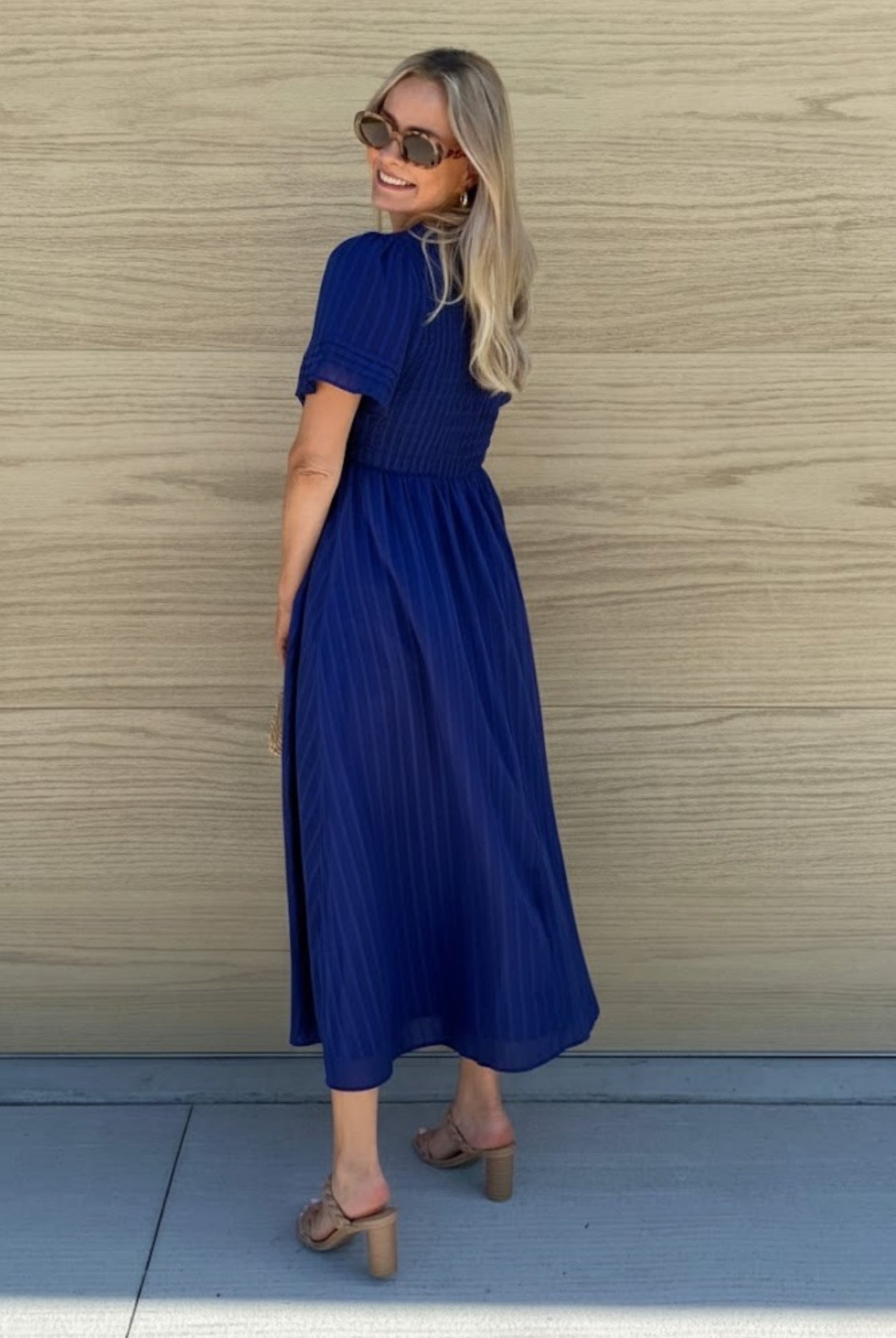Women's navy A-line midi dress styled outfit by Esther & Co