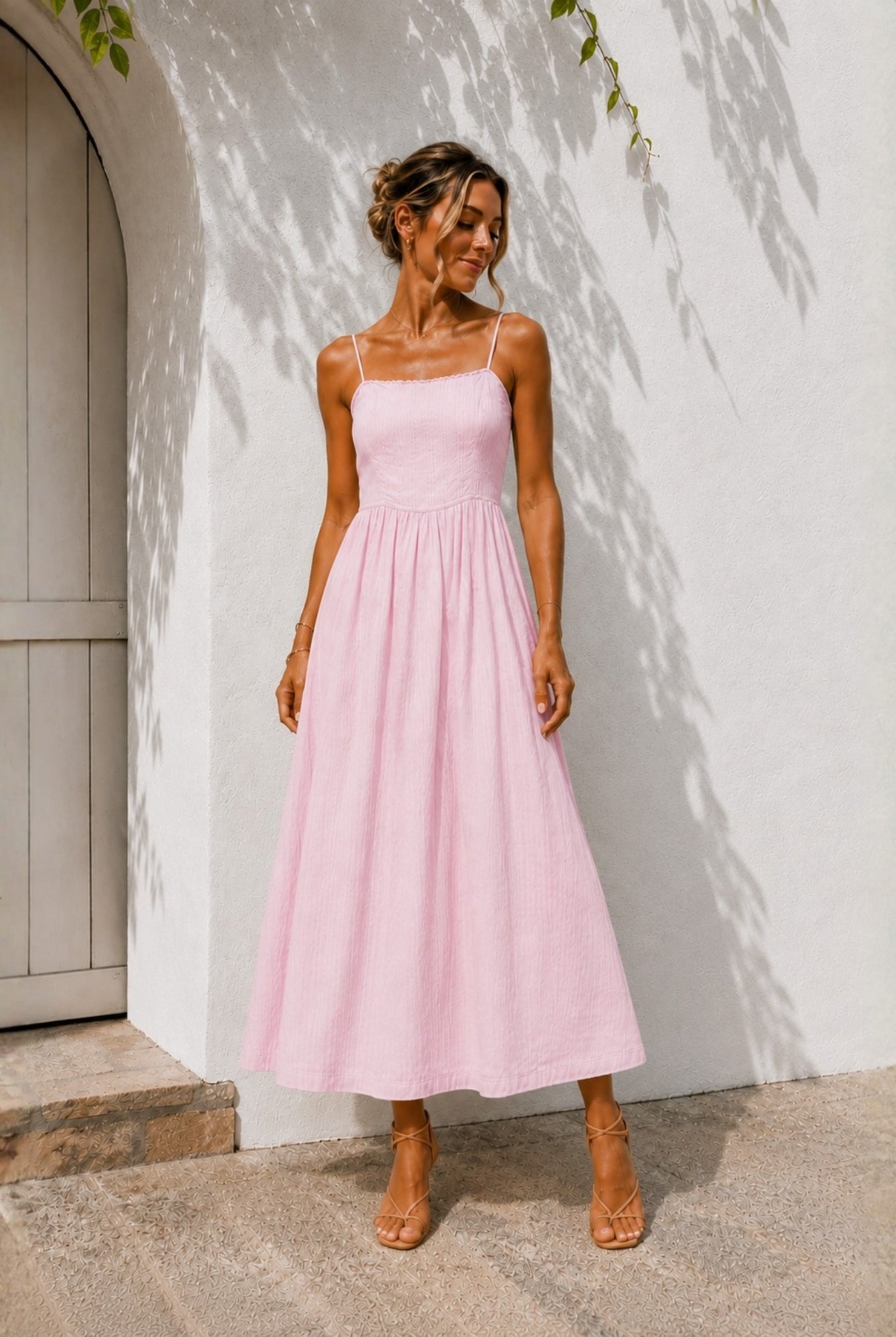 Women's pastel pink midi dress with adjustable spaghetti straps by Esther & Co