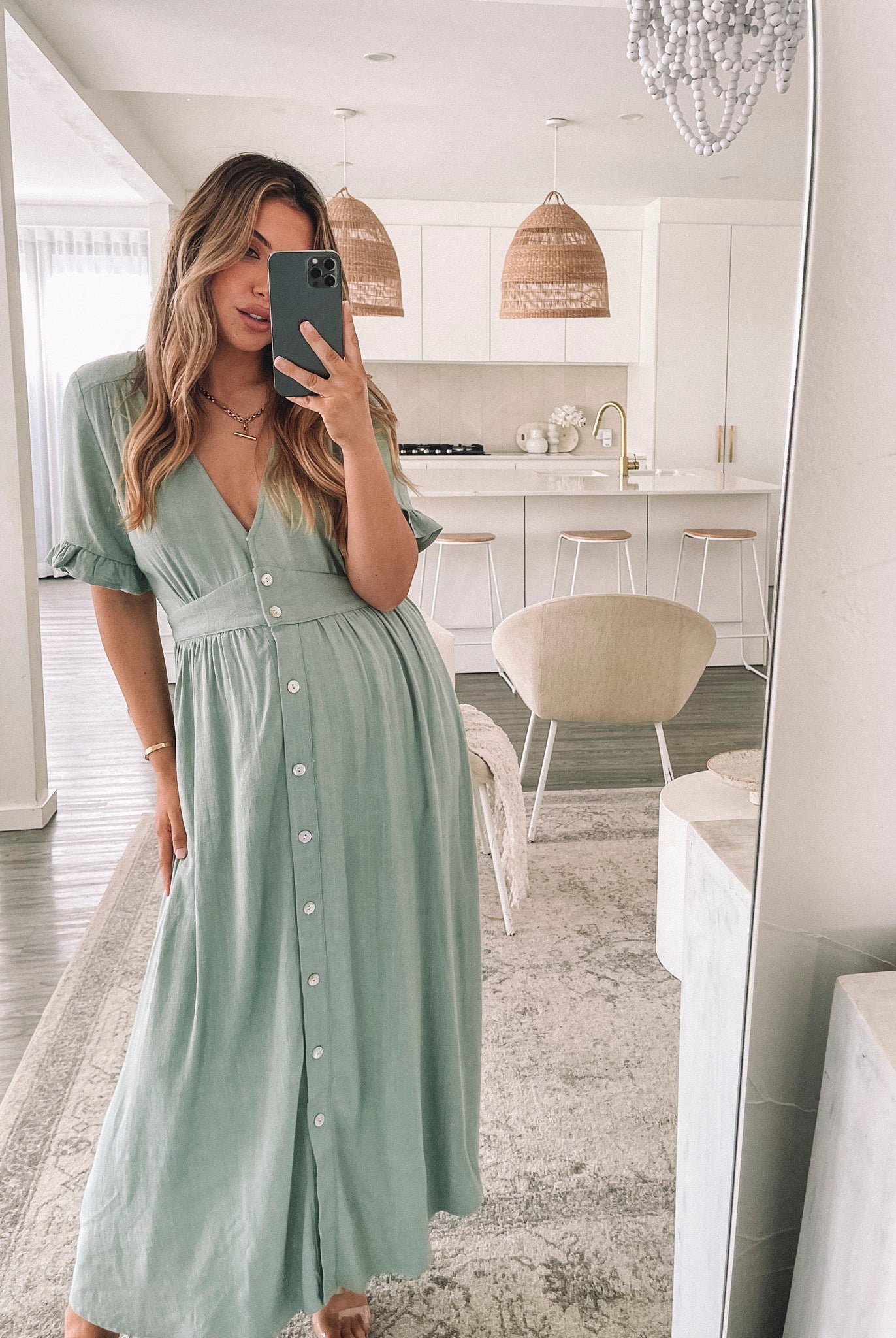 Back view of the Korbela Sage Linen Midi Dress by Esther and Co