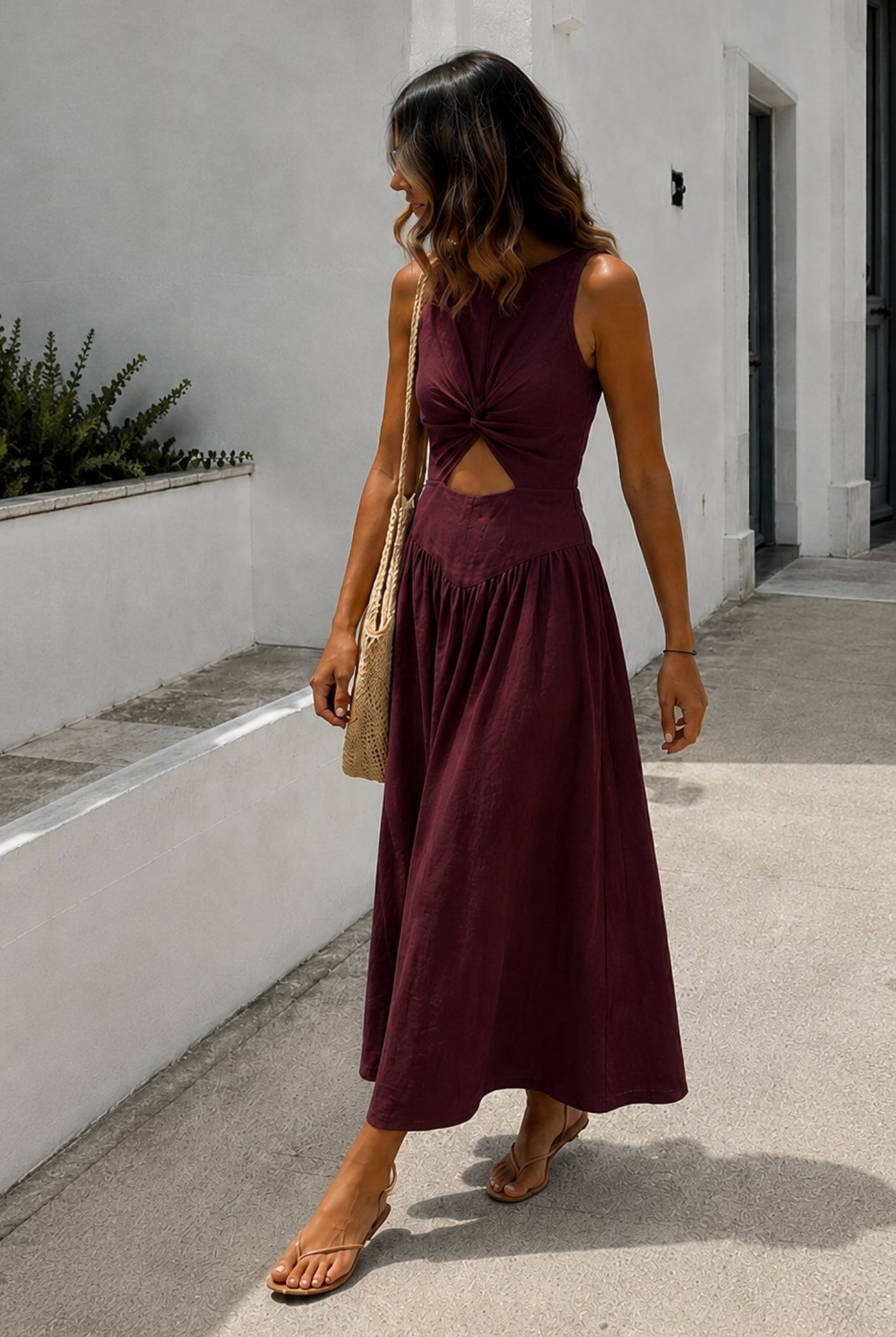 Women's plum sleeveless linen midi dress side view, the Kirah Dress in Plum by Esther & Co