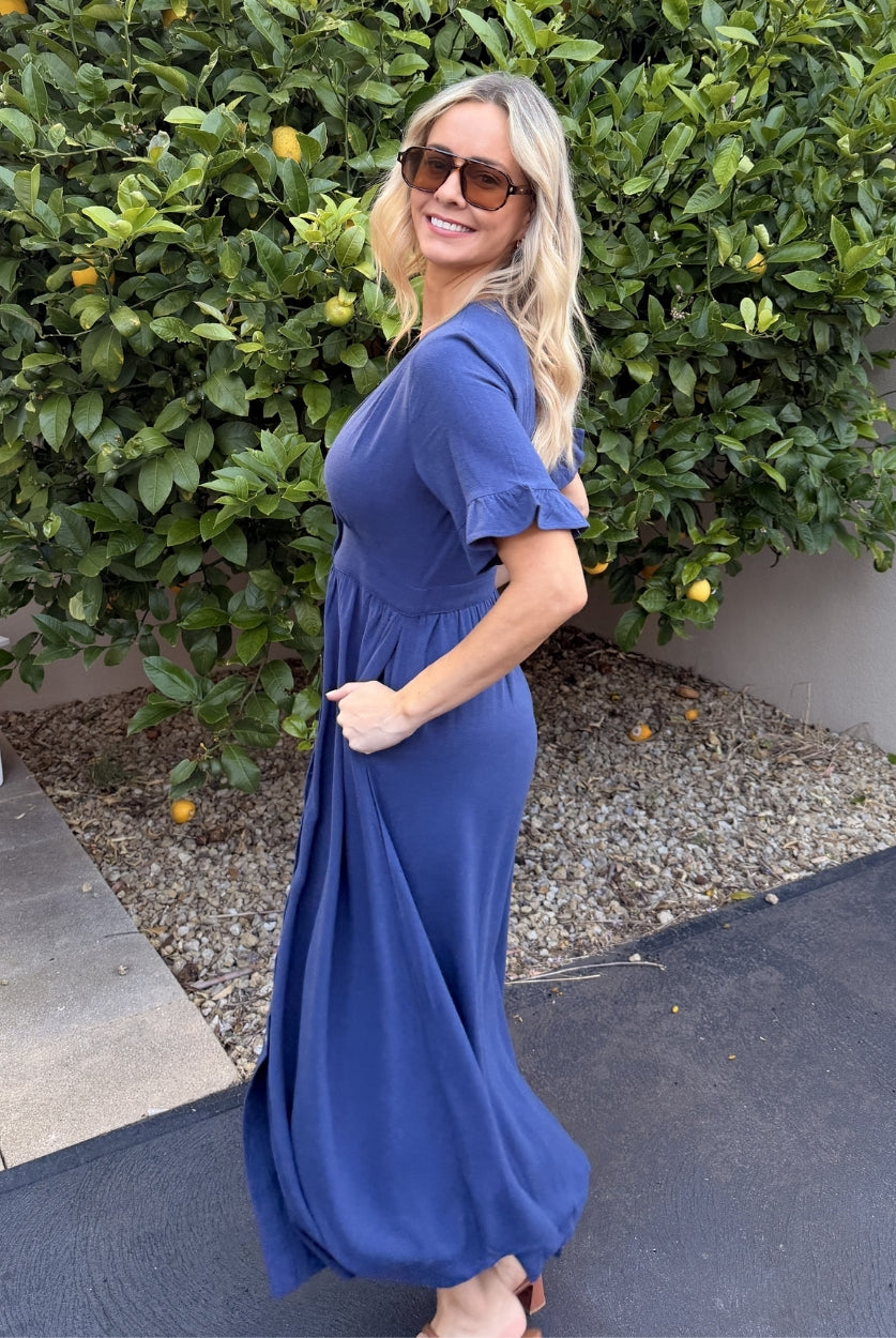 Front view of the Korbela Navy Linen Midi Dress showing the V-neckline and relaxed A-line fit
