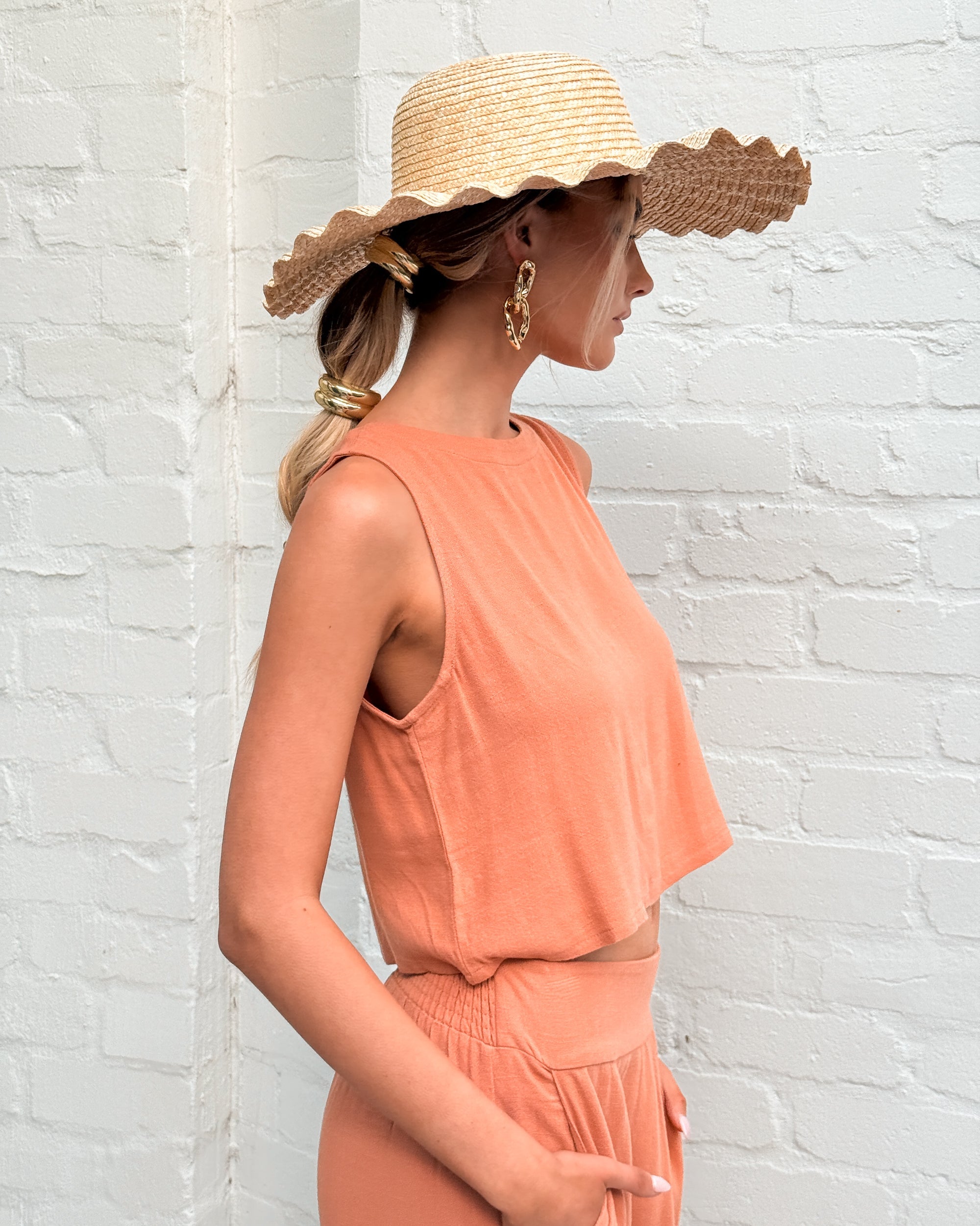 Women's cropped rust linen top styled for summer by Esther & Co