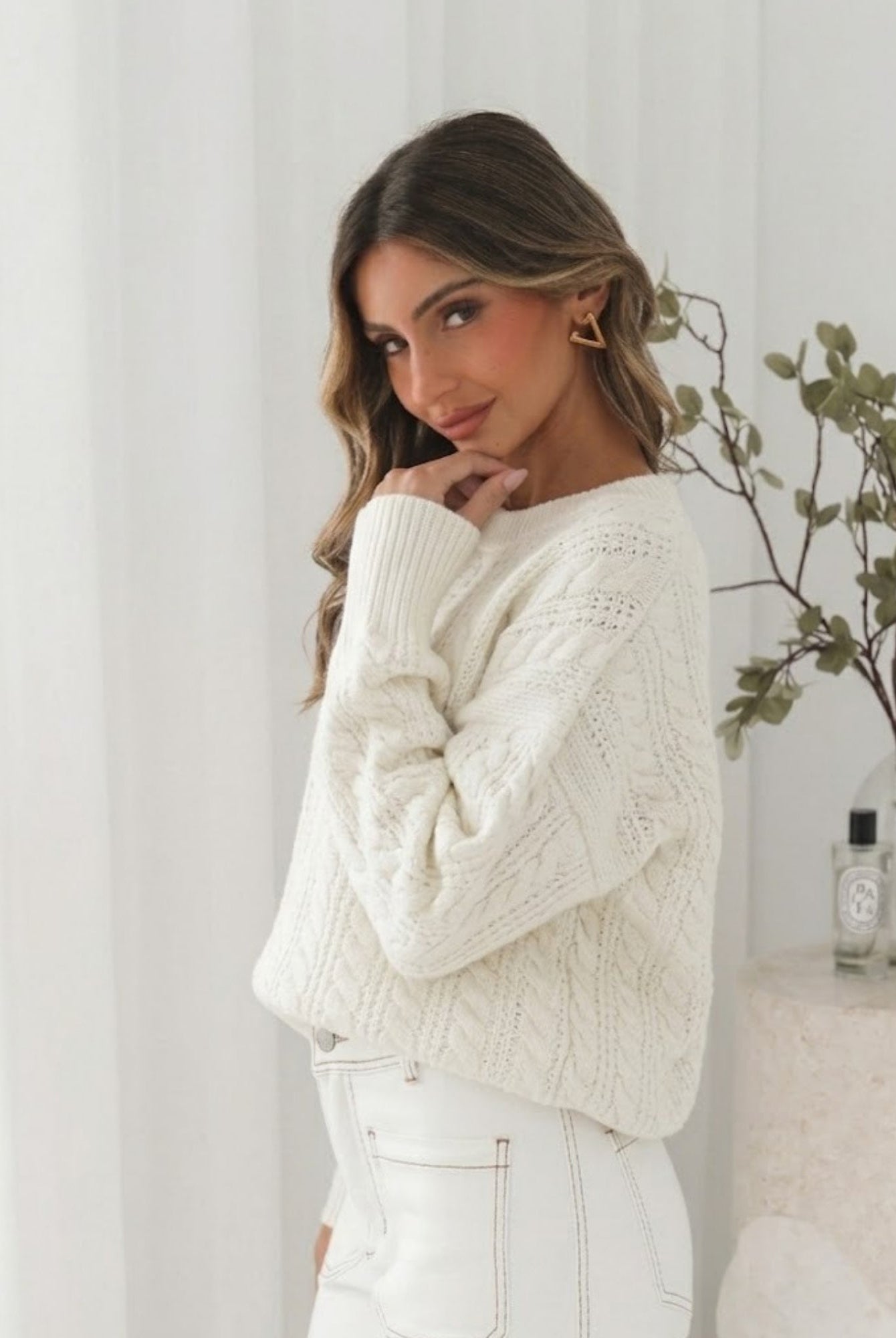 Oriah cream knit worn with jeans, full-length
