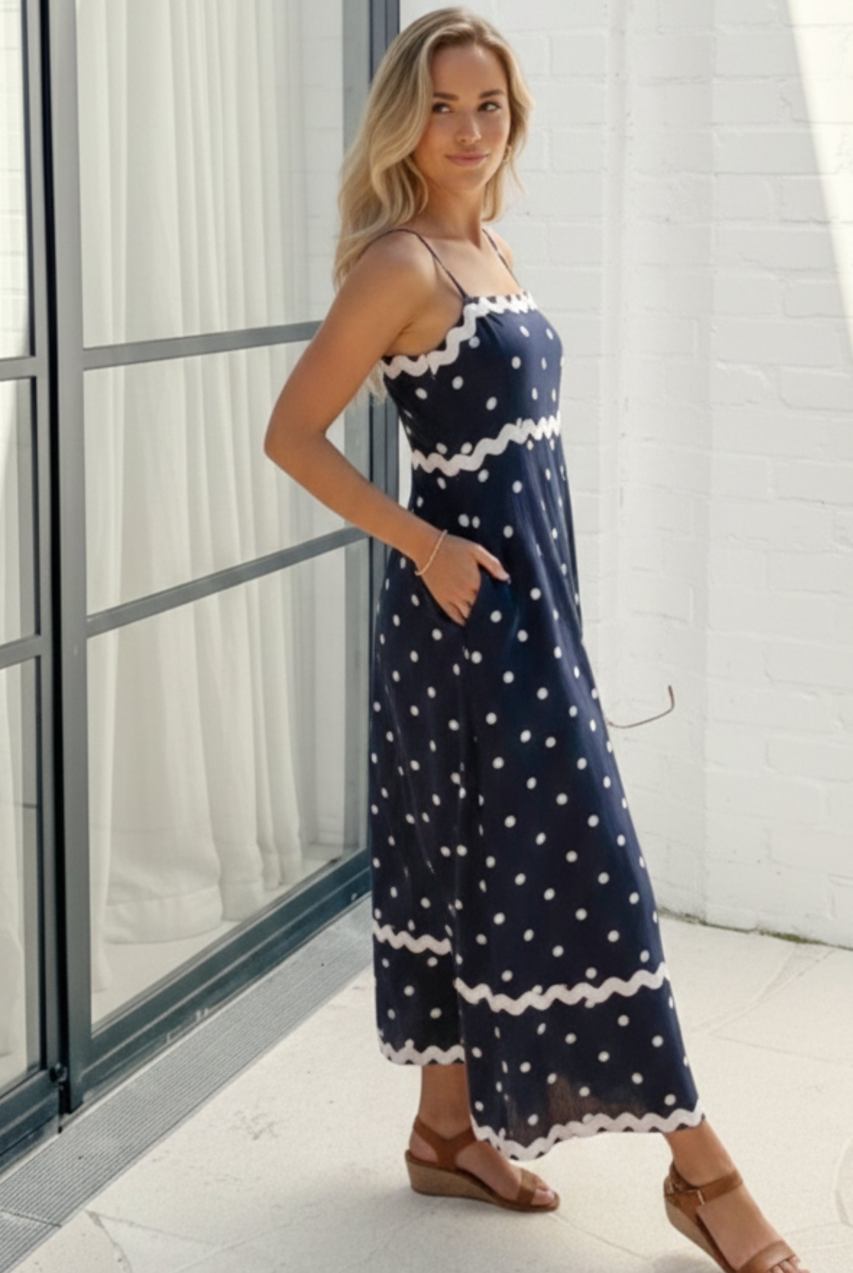 Women's navy polka dot midi dress side view by Esther & Co