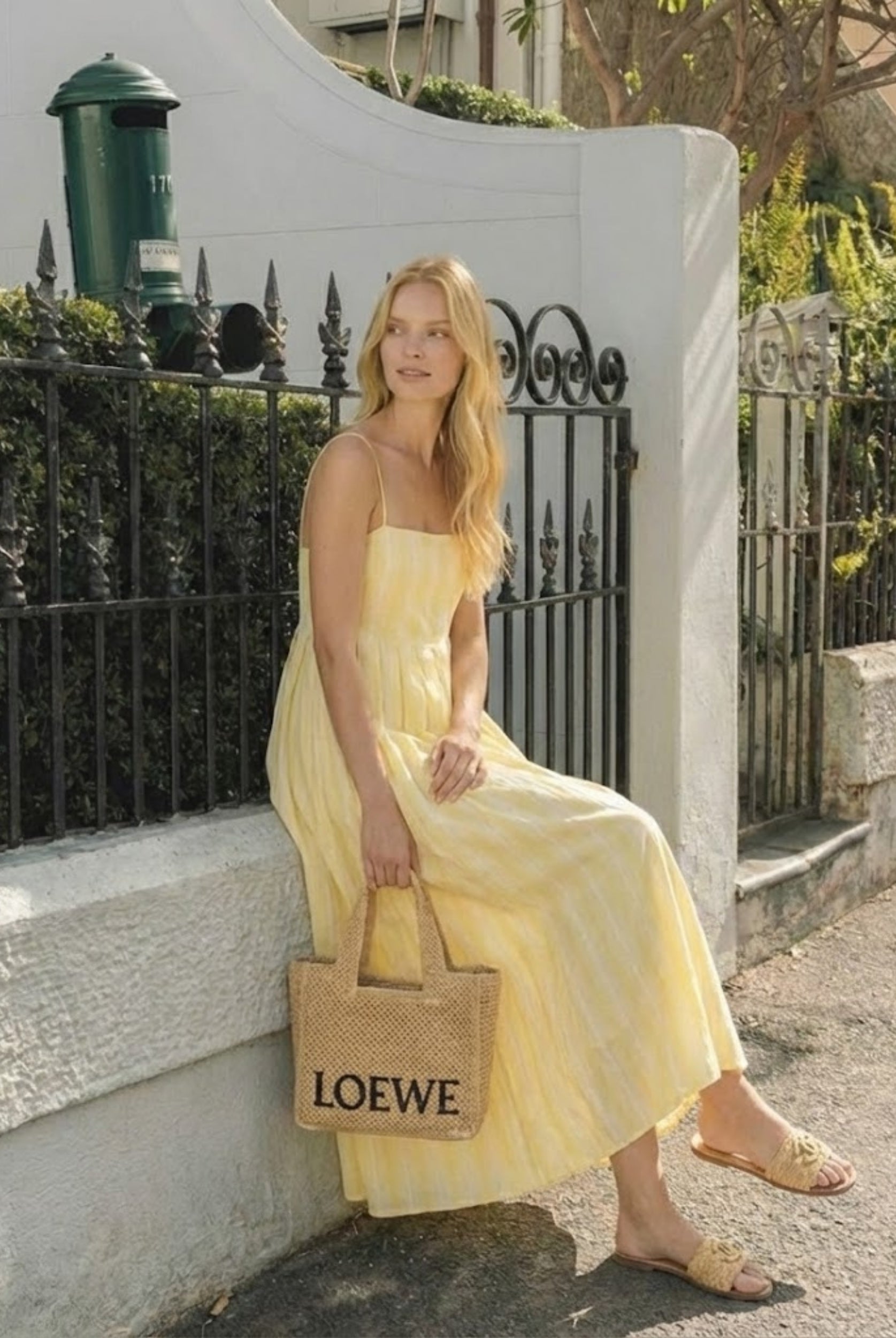 Women's yellow stripe maxi dress styled outfit by Esther & Co