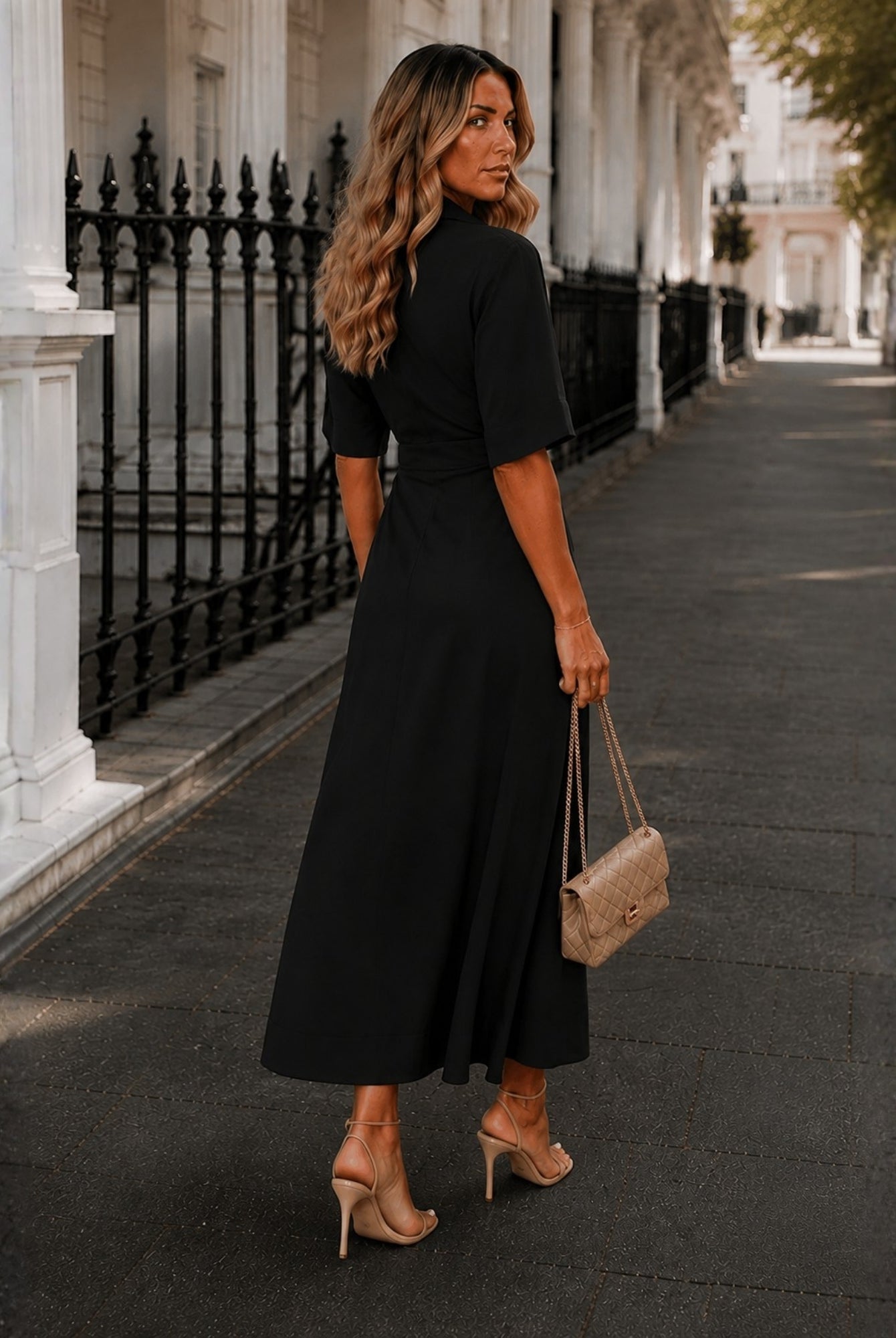 Women's black v-neck wrap dress front view, the Sephora Dress in Black by Esther & Co