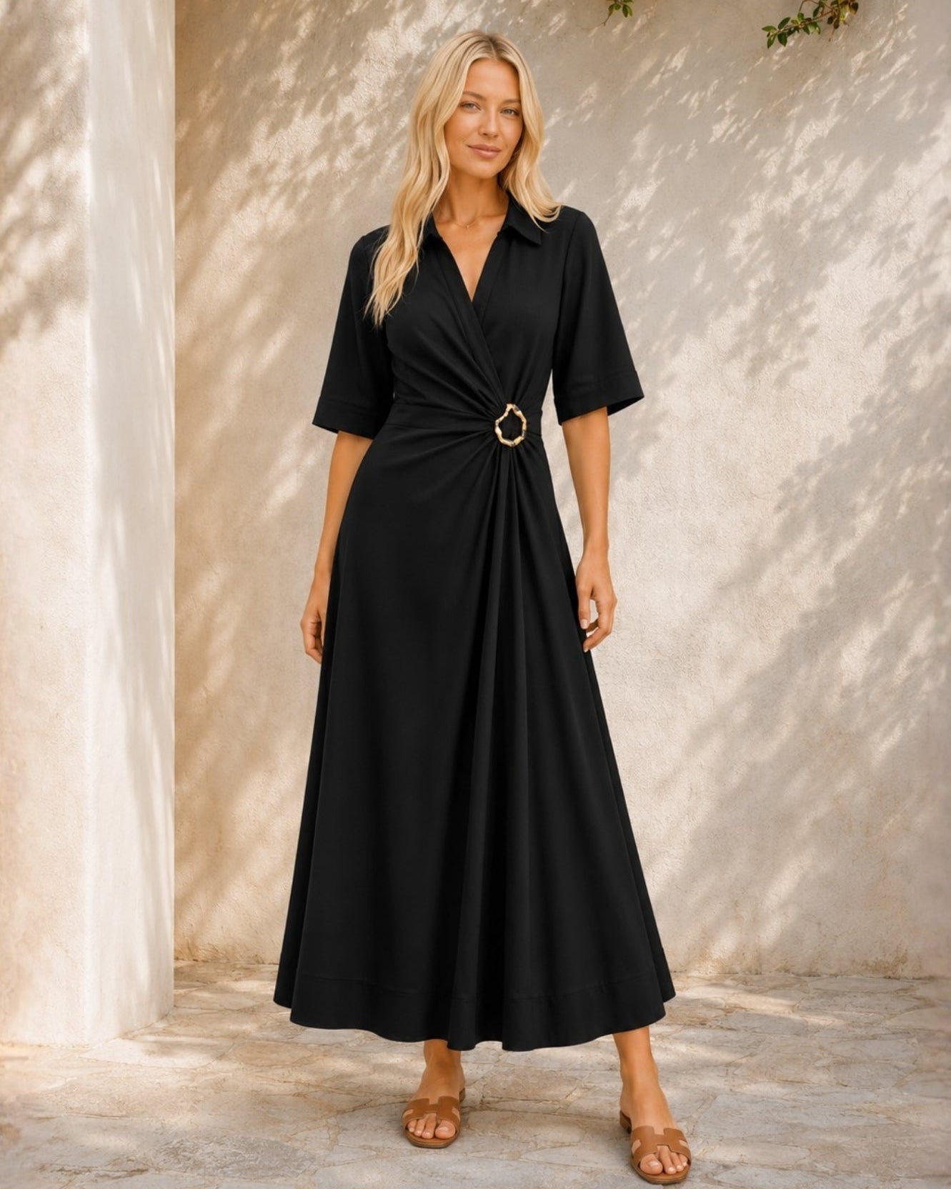 Women's black v-neck wrap dress with gold ring waist detail, the Sephora Dress in Black by Esther & Co