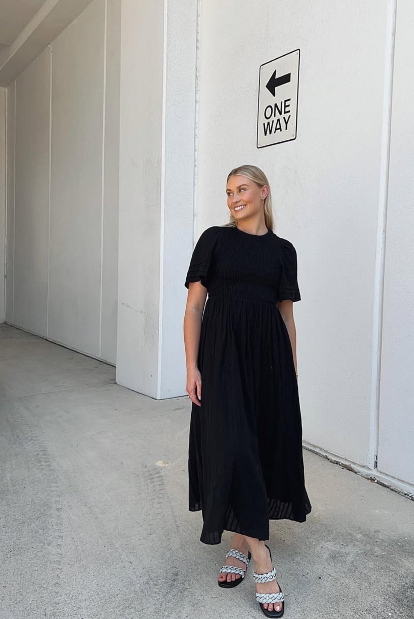 Influencer wearing the Iolana Black Midi Dress from Esther and Co showing the versatile everyday styling
