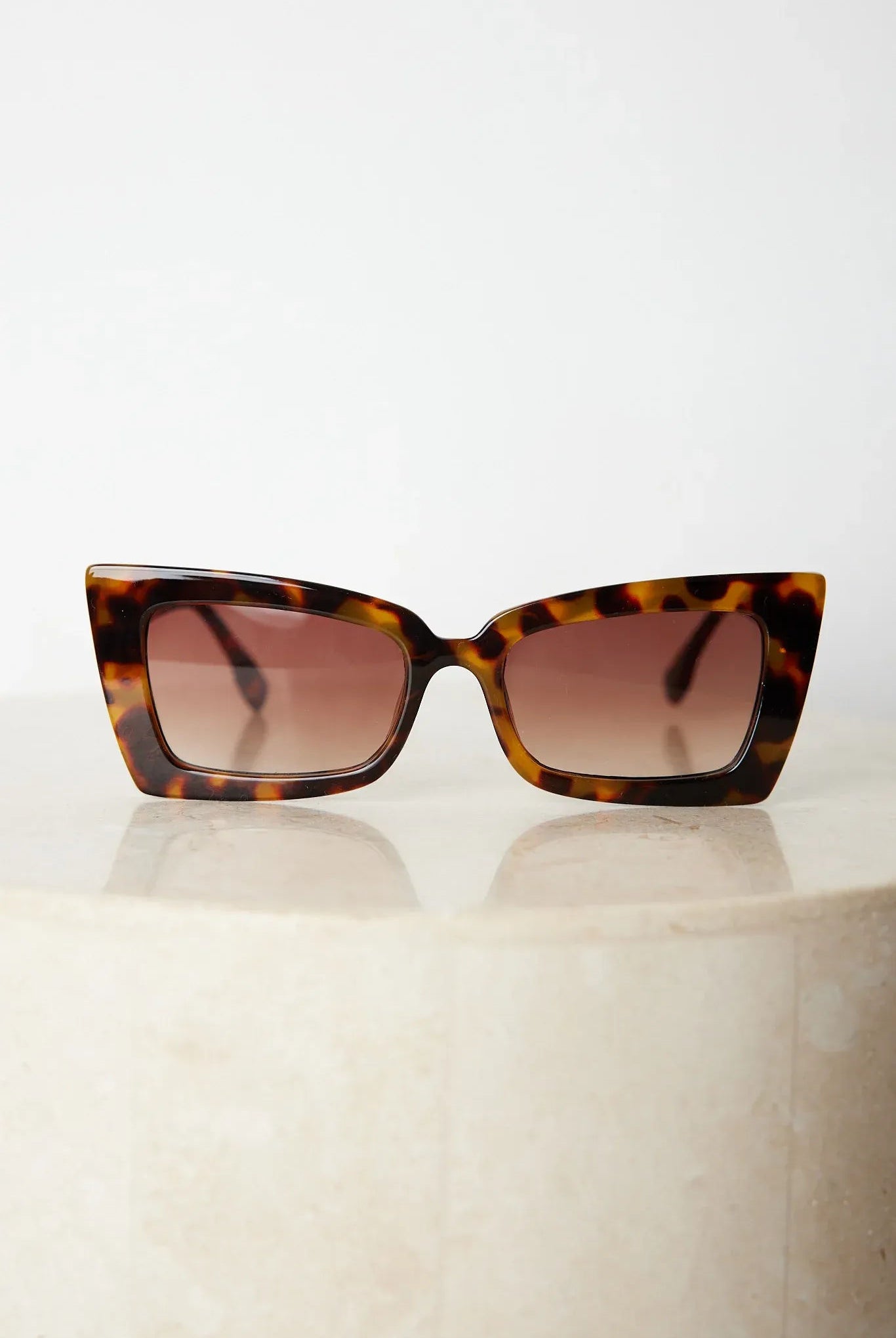 Tortoiseshell frame sunglasses with dark lenses, the Landon Sunglasses in Tortoise by Esther & Co