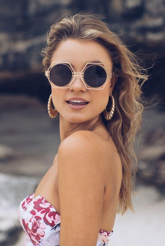 Black frame sunglasses with dark lenses, the Catalina Sunglasses in Black by Esther & Co