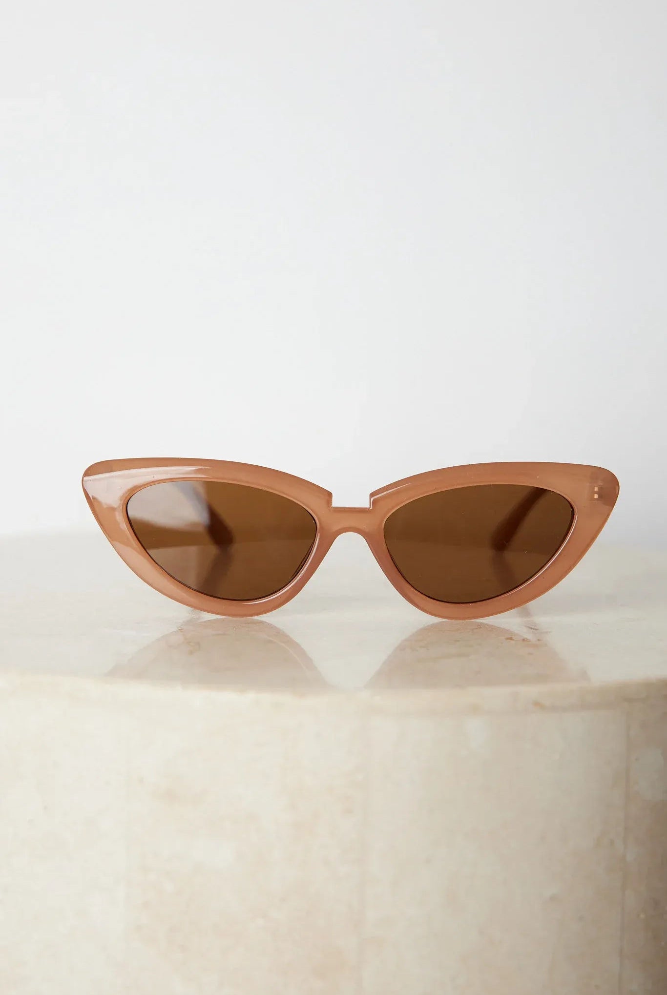 Tan frame sunglasses with dark lenses, the Finlay Sunglasses in Tan by Esther & Co