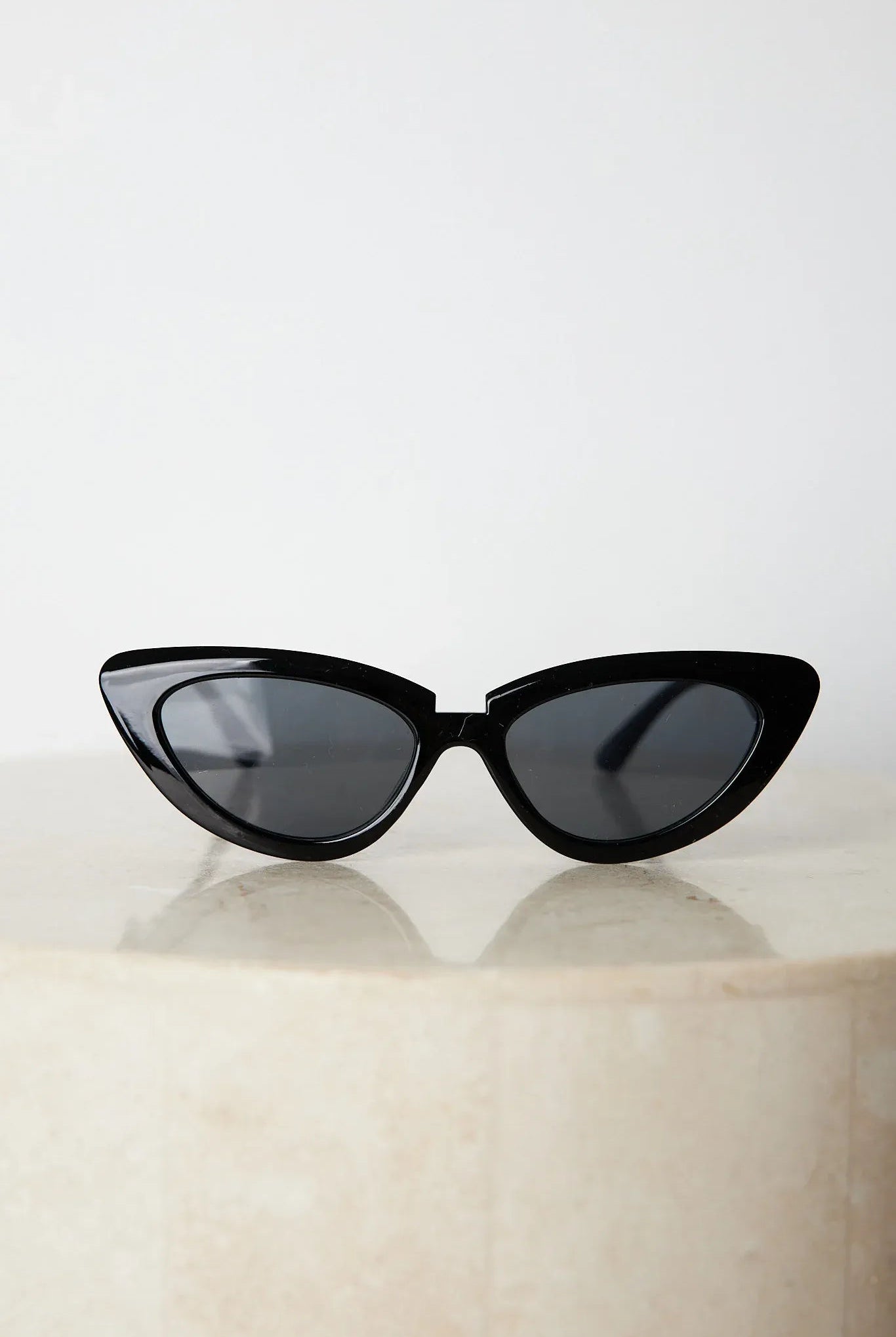 Black frame sunglasses with dark lenses, the Finlay Sunglasses in Black by Esther & Co