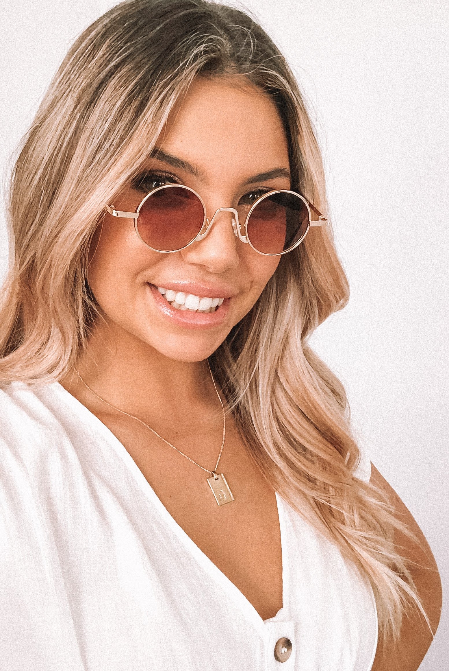 Rose gold frame sunglasses with transparent blush lenses, the Monaco Sunglasses in Blush by Esther & Co