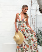 Women's beige print flowy maxi dress styled with heels by Esther & Co