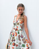 Women's beige print halter maxi dress side view by Esther & Co