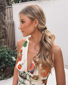 Women's beige multi-print halter maxi dress back view by Esther & Co