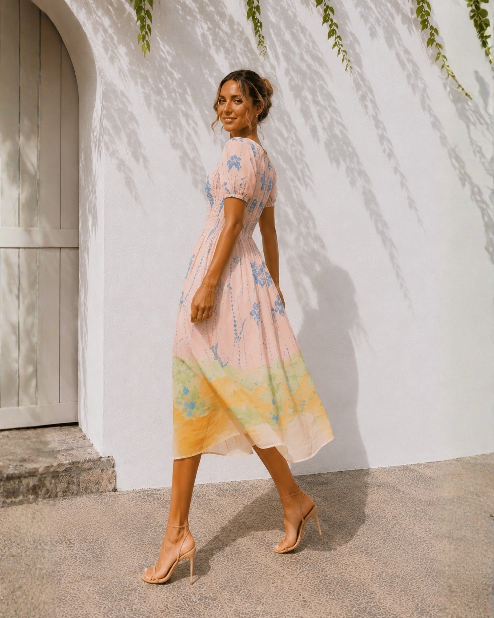 Women's pastel pink pleated bodice midi dress with puff sleeves, the Aseana Dress in Island Dream by Esther & Co