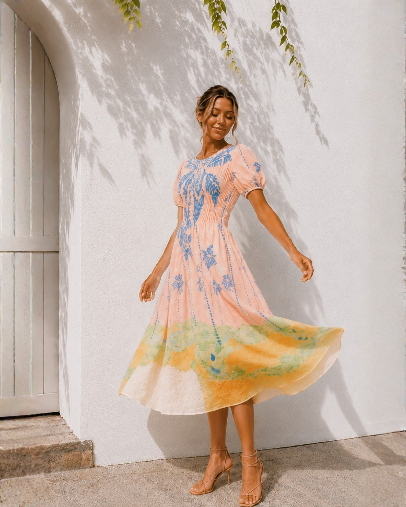 Women's pastel pink embroidered midi dress with puff sleeves, the Aseana Dress in Island Dream by Esther & Co