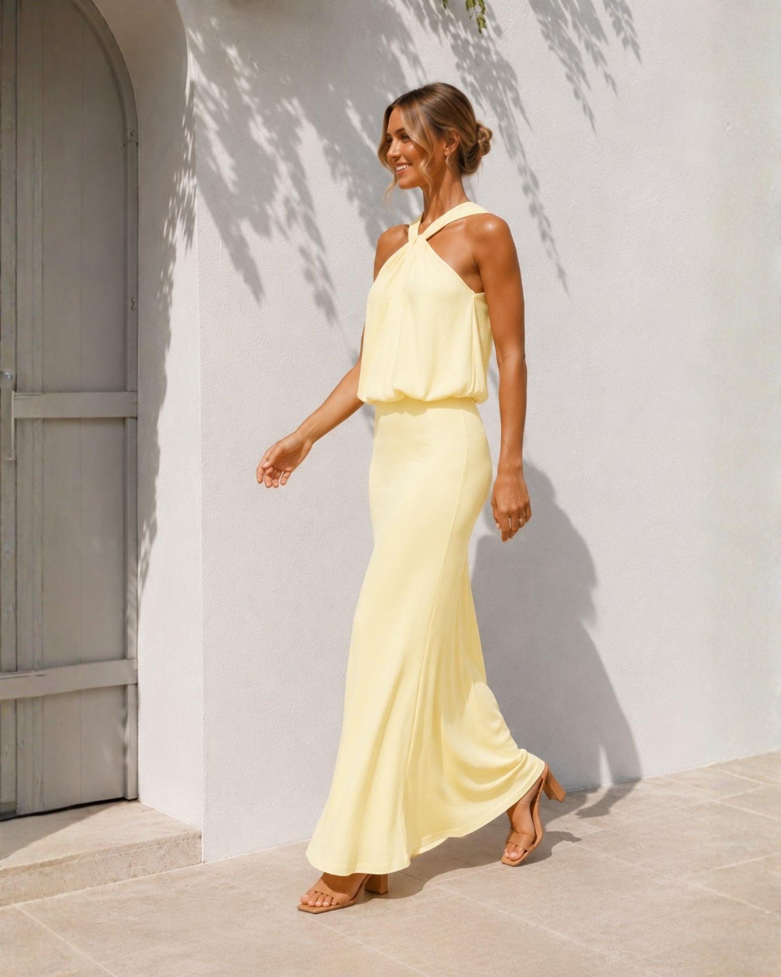 Women's yellow halter maxi dress side view by Esther & Co