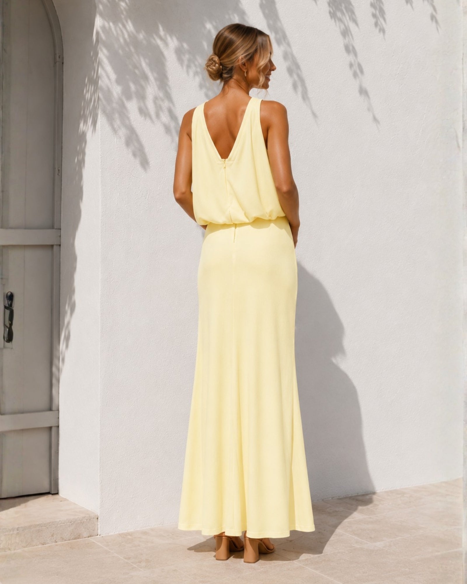 Women's yellow halter maxi dress styled outfit by Esther & Co