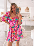 Women's pink print playsuit with thigh-length shorts by Esther & Co